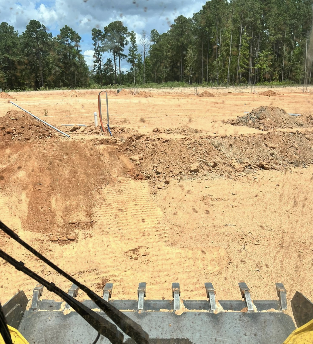 Professional grading services completed in Clover, SC to improve drainage and site conditions.