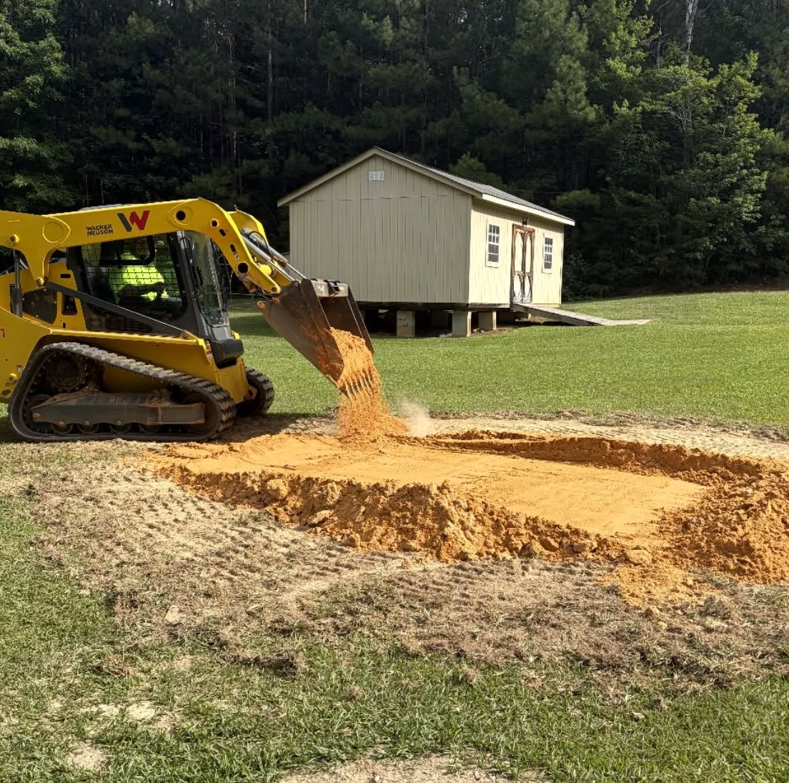 Gravel driveway installation completed in Matthews, NC with a professionally graded base.