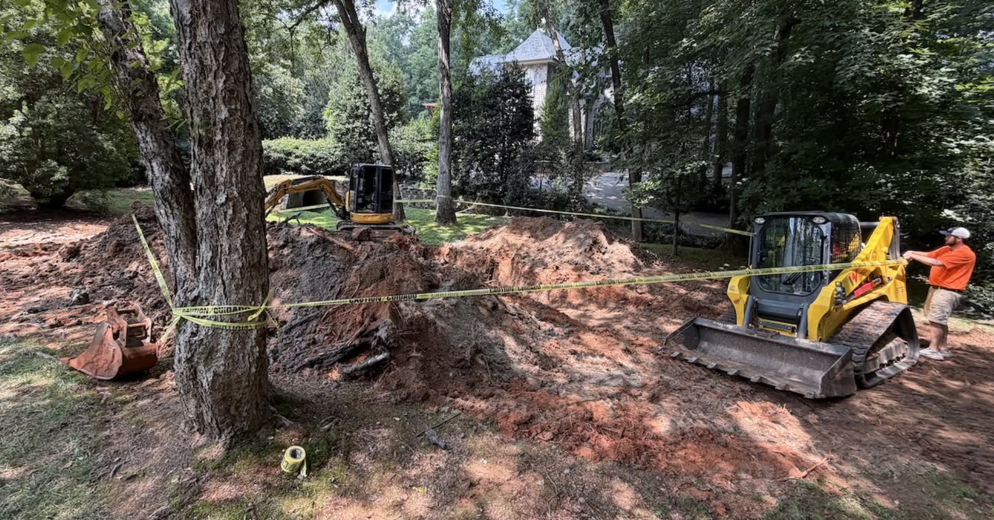 Heavy equipment performing sinkhole remediation, excavation, structural fill installation, and site preparation by Palmetto South Construction.