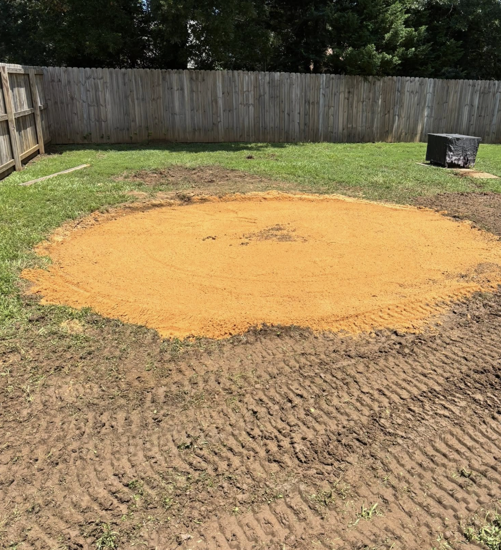 Land clearing and site preparation completed in Charlotte, NC for a future construction project.