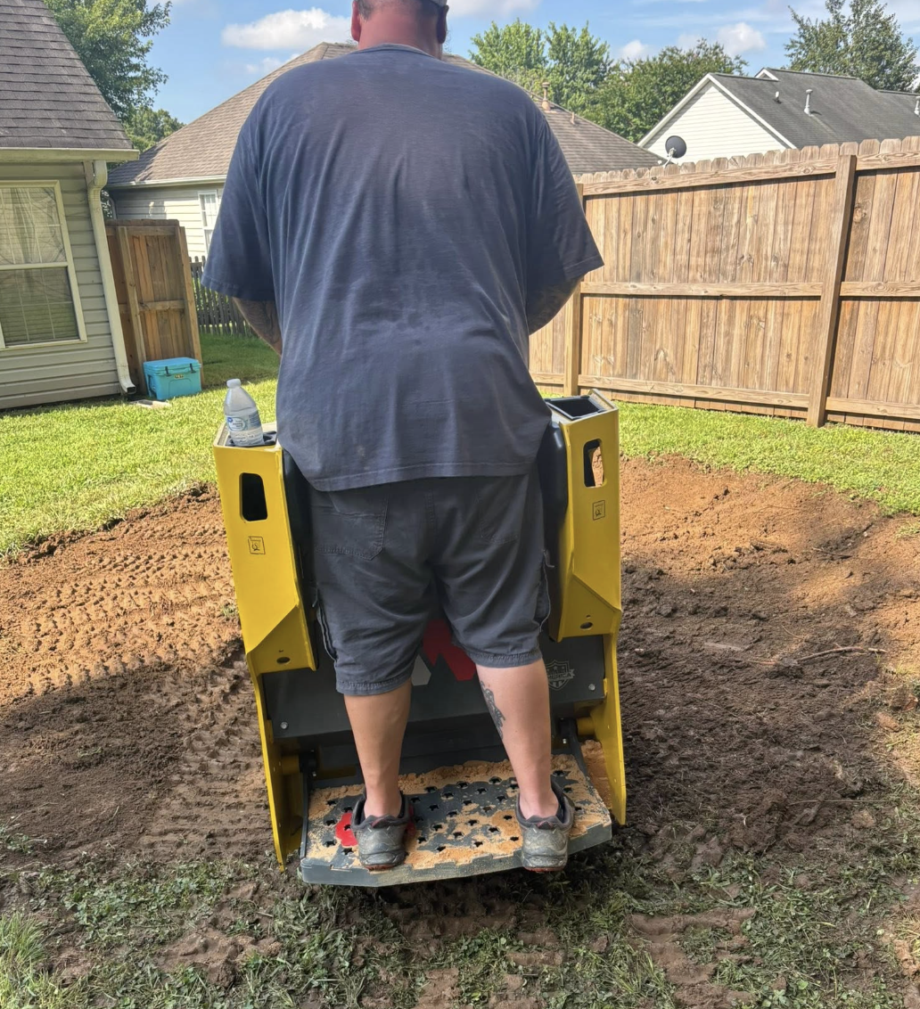 Parking pad installation completed in Monroe, NC with professional grading and excavation.