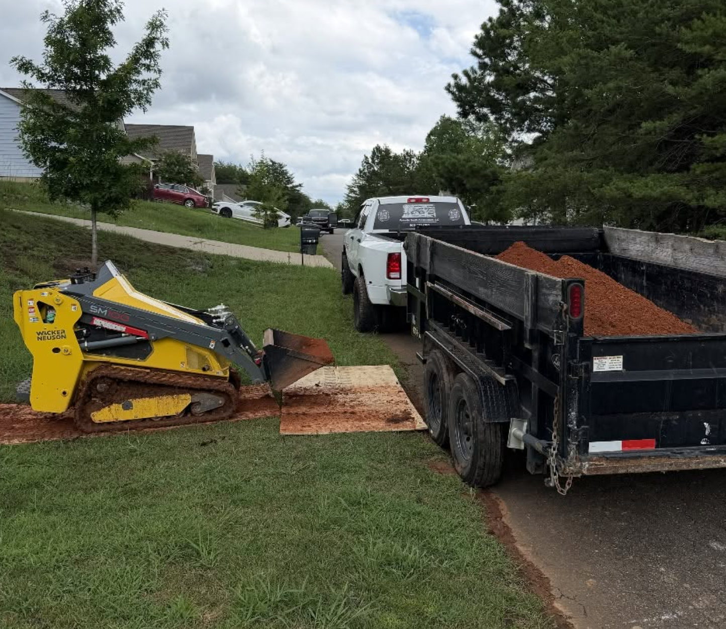 Excavation equipment and materials on site for a residential in-ground trampoline project in Lancaster, SC