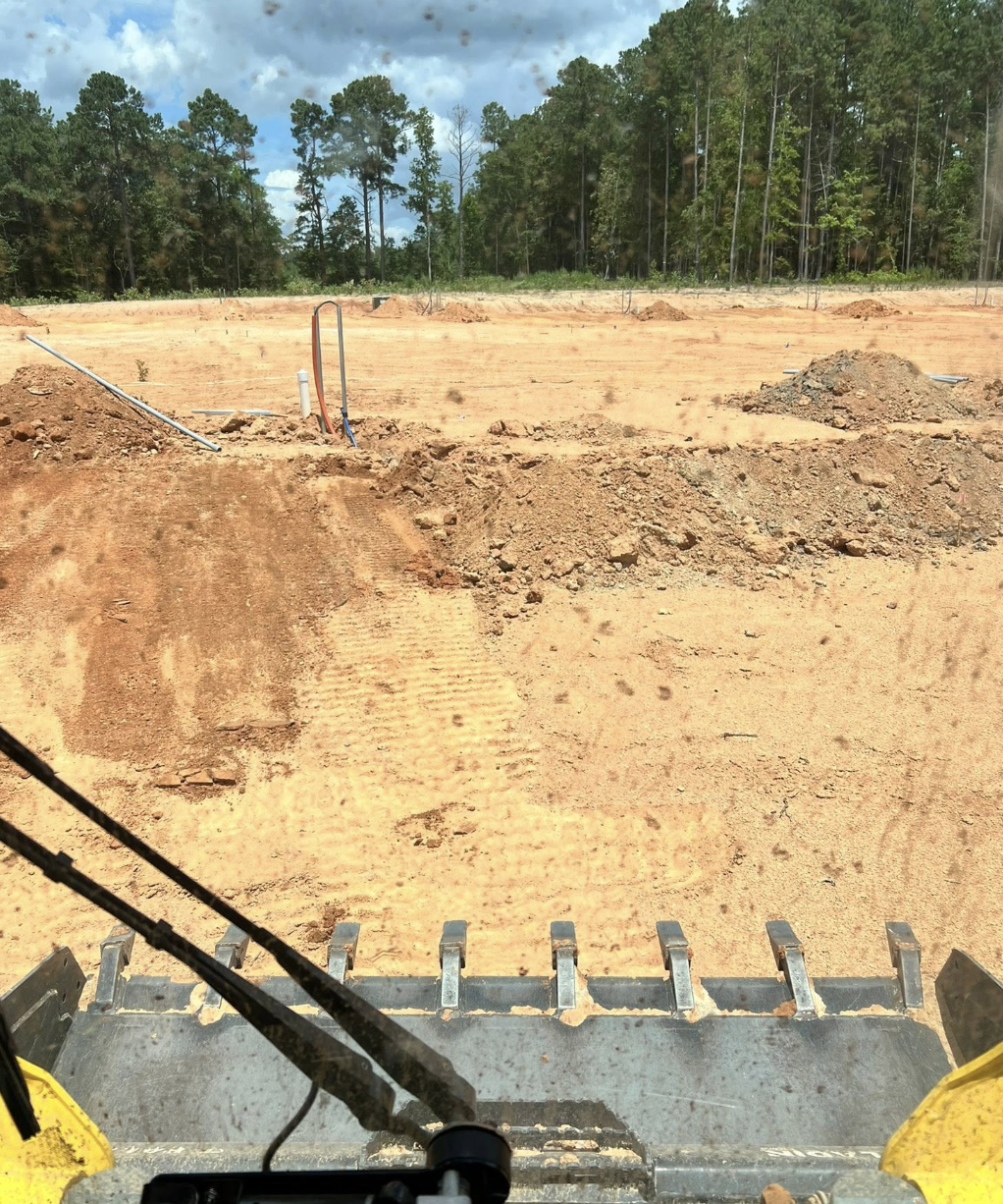 Land clearing and excavation completed in Marvin, NC for residential property improvements.