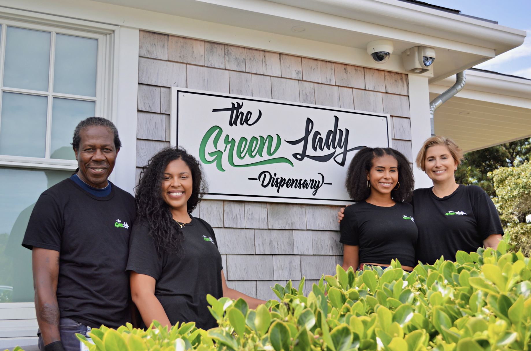The Campbell family standing outside the Nantucket location of The Green Lady Dispensary