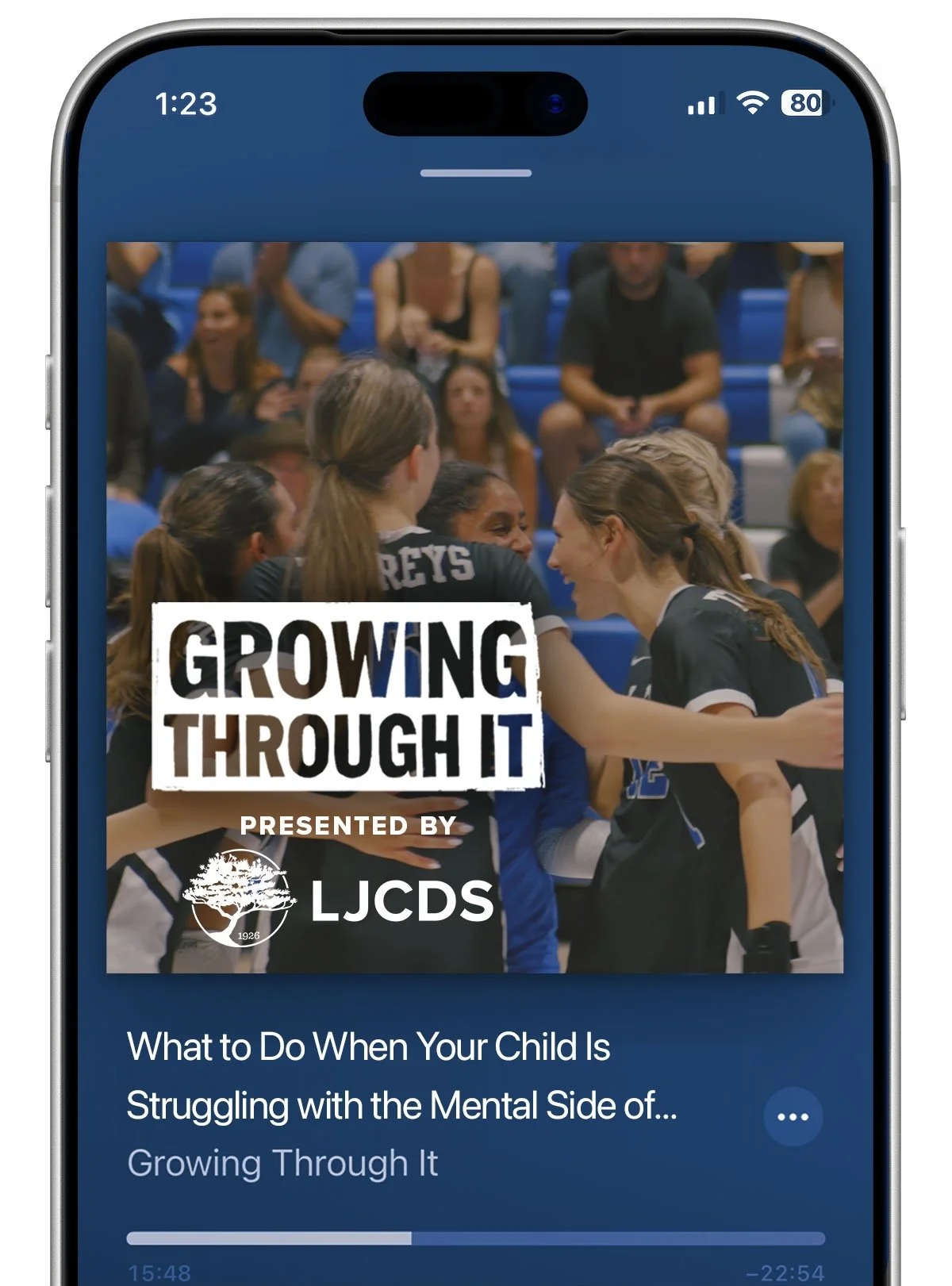 Mobile phone displaying a podcast cover titled 'Growing Through It,' presented by LJCSD, featuring a photo of female athletes celebrating on a volleyball court.