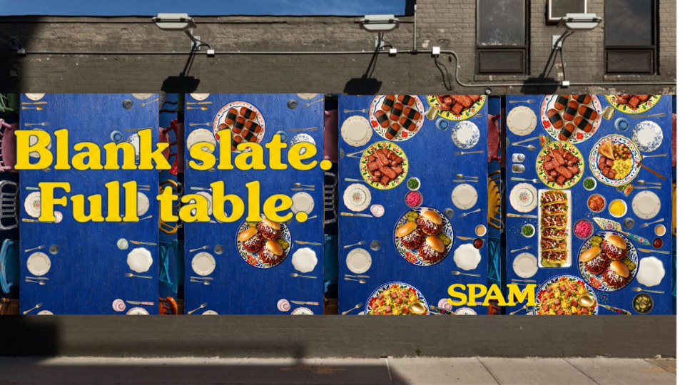 Colorful murals of tables filled with various dishes and plates of food against a blue background, with large yellow text saying "Blank slate. Full table. SPAM."