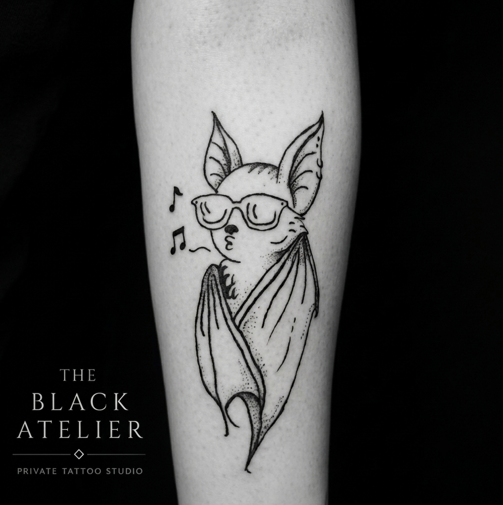Tattoo of a fox wearing sunglasses and a shawl, with musical notes nearby, on a person's arm.