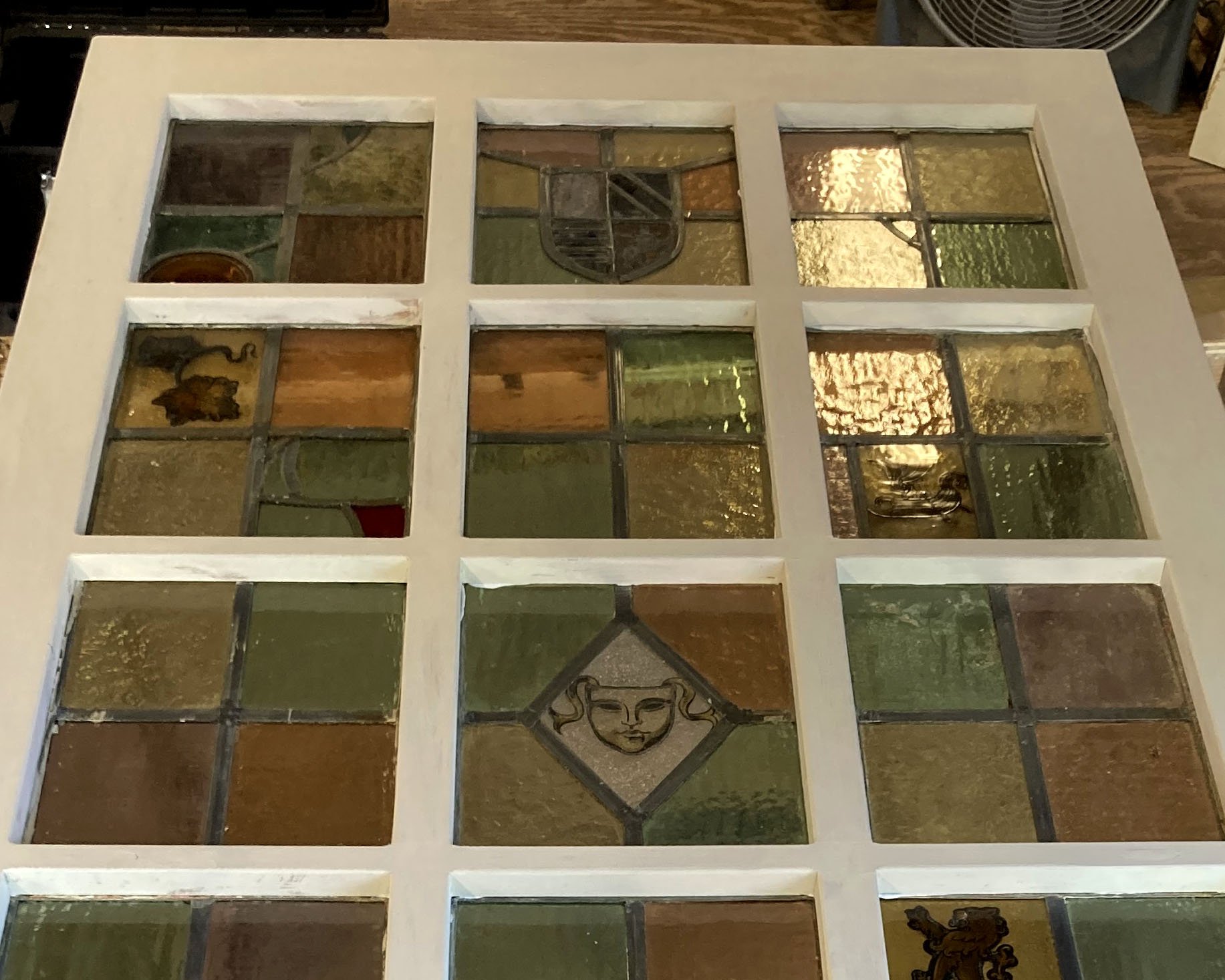 Custom door to hold more than 12 individual handmade stained glass panels