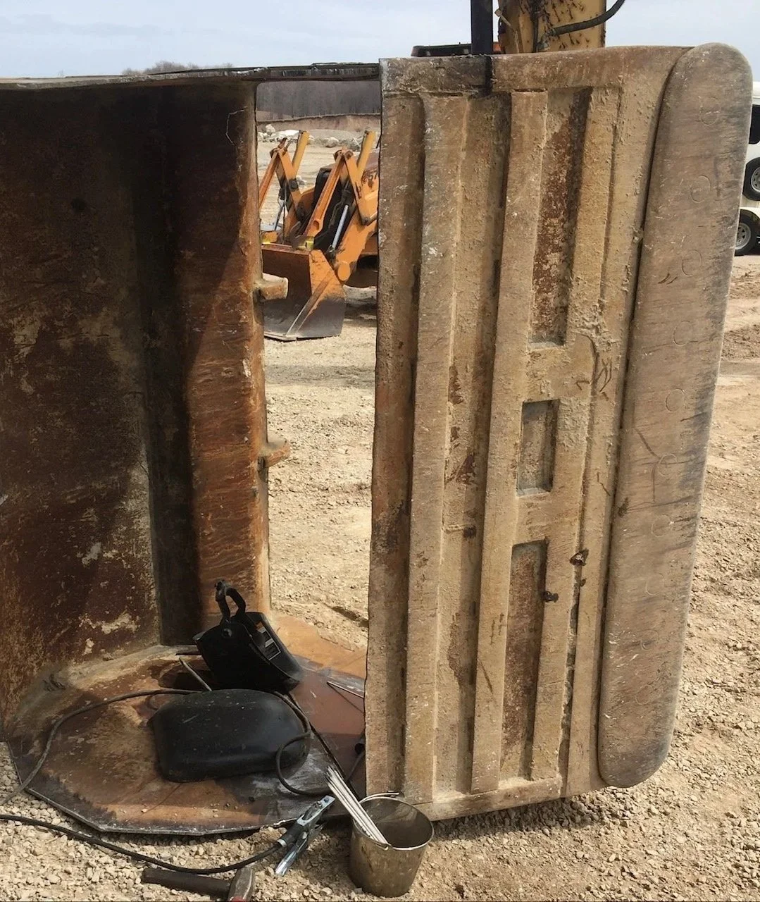 Heavy equipment repair, Caterpillar 349 ditching bucket skin replacement.