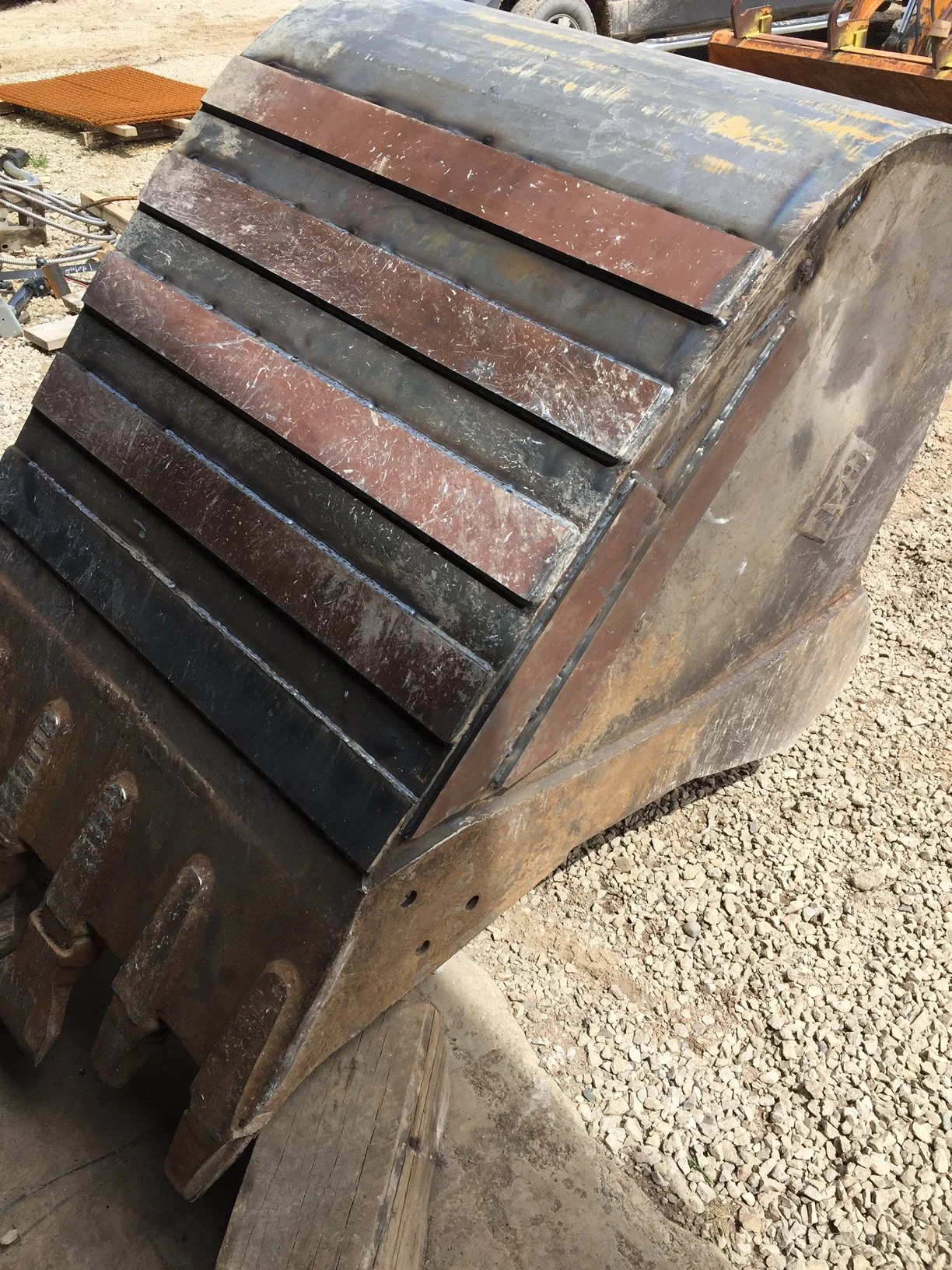 Completed heavy equipment repair, Caterpillar 330 bucket with replacement skin and wear strips.
