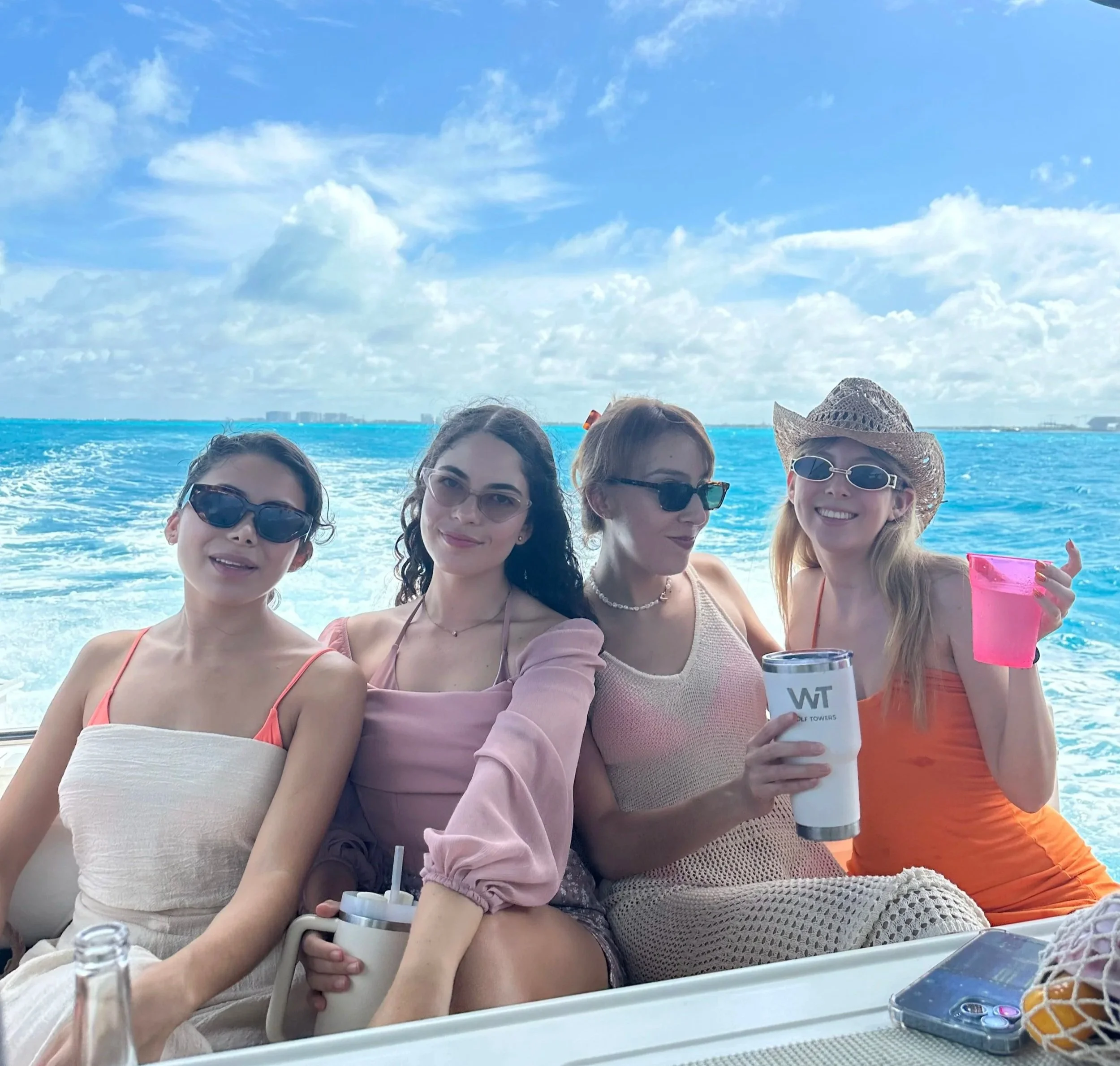 Girls enjoying a yacht experience in Cancun during The Summer Reset by The Reset Club