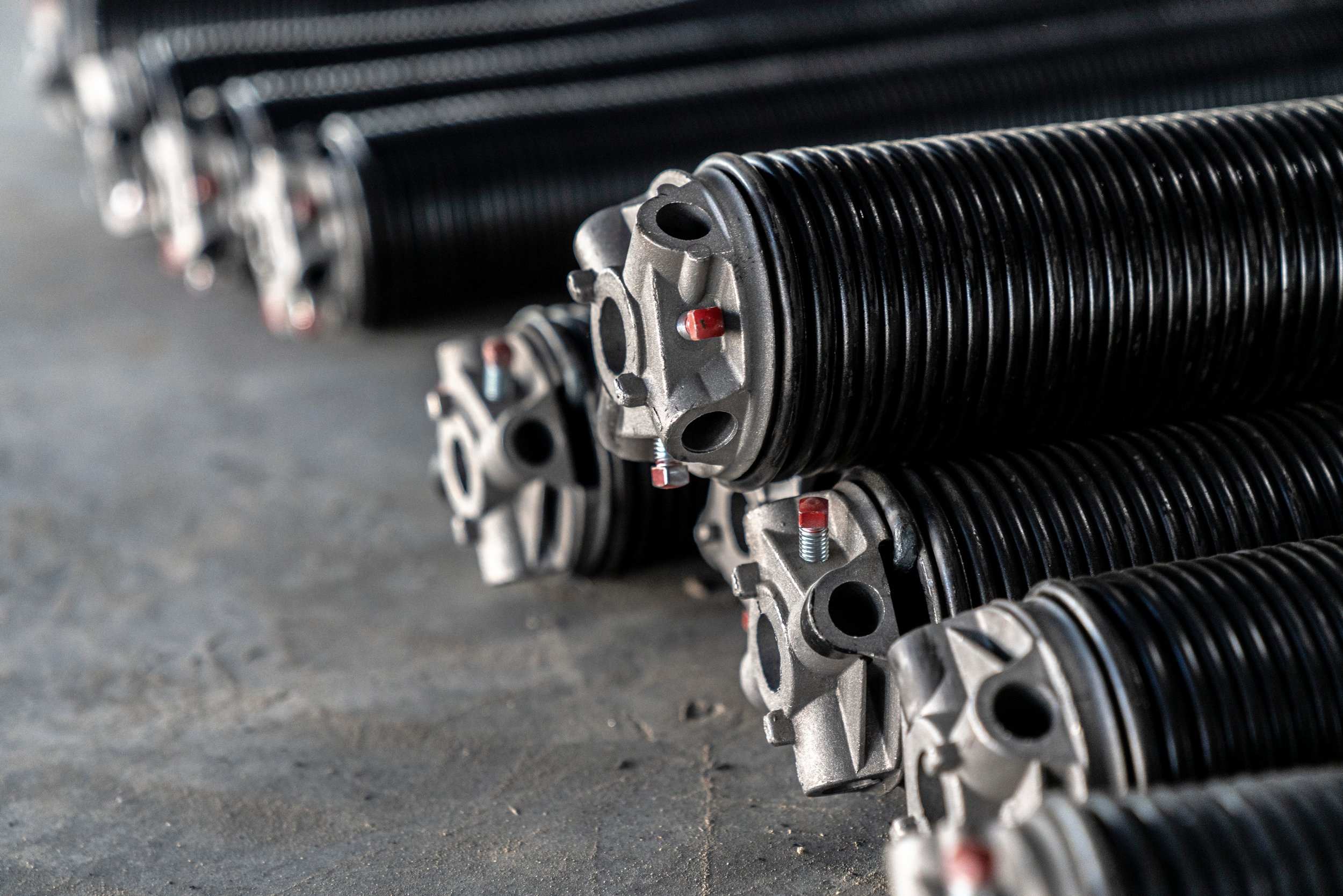 Garage door torsion springs for professional garage door repair and replacement services by Alpine Overhead Doors in San Diego County.