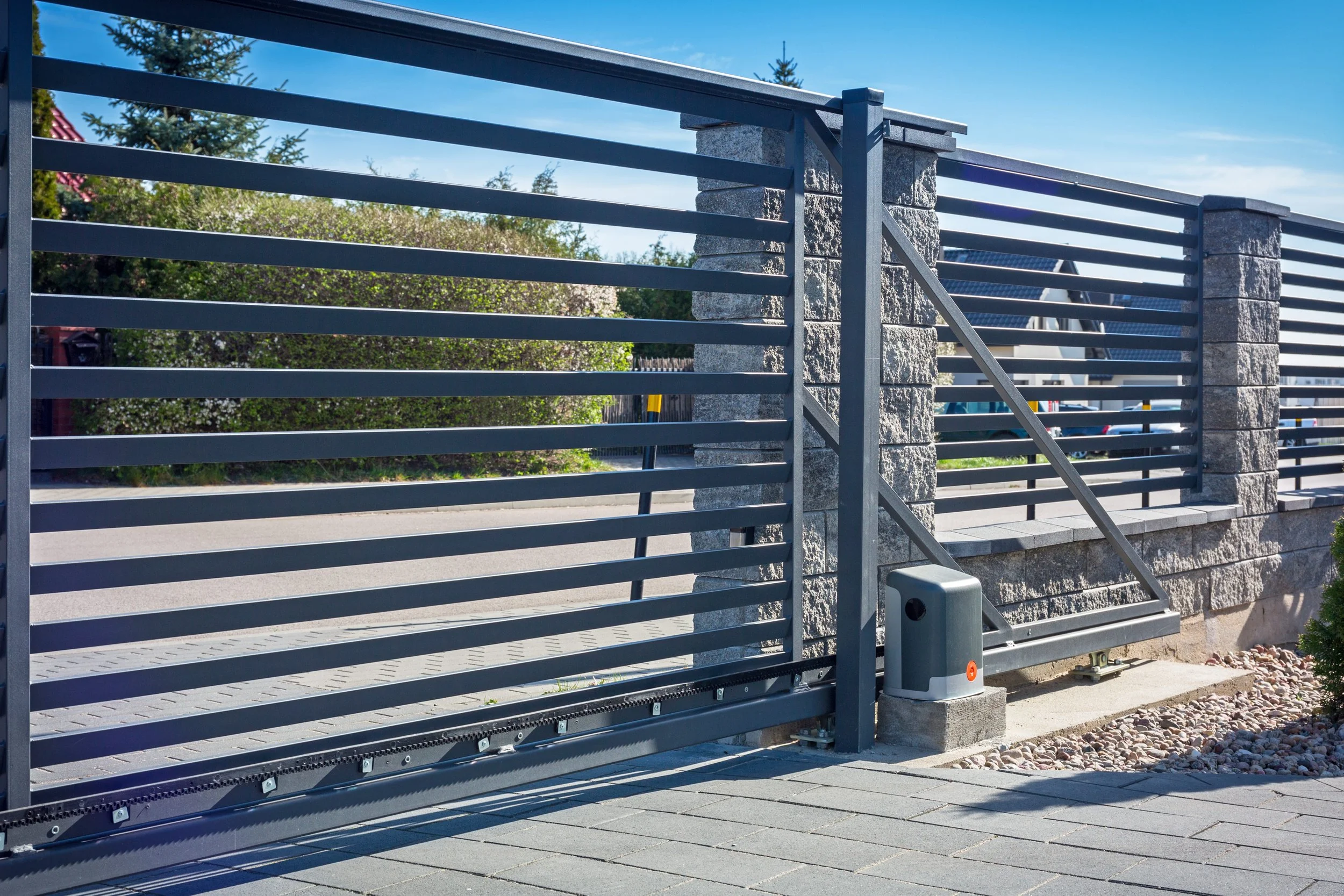 Automatic driveway gate with gate opener installation for residential and commercial properties by Alpine Overhead Doors in San Diego County.