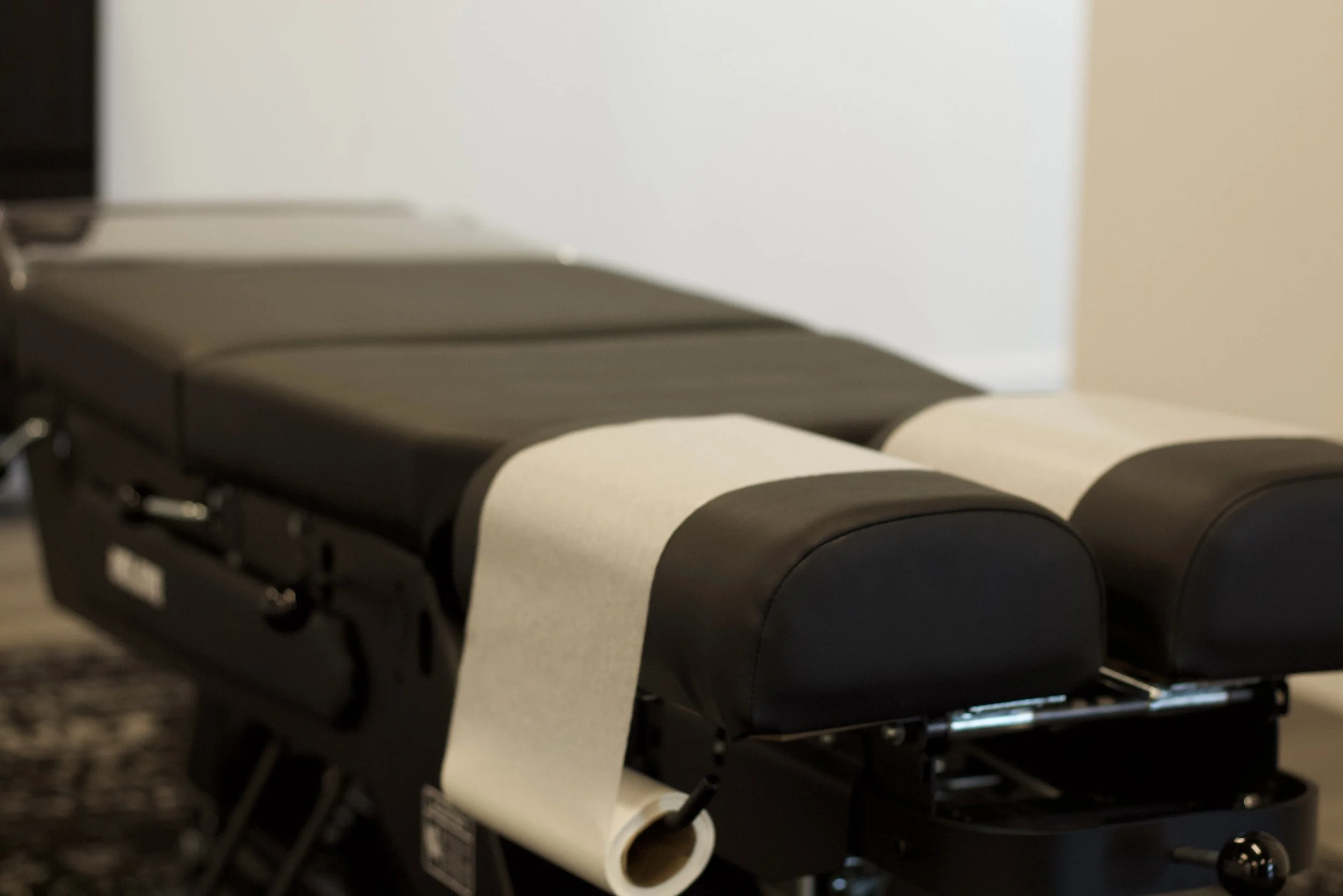 Chiropractic adjusting table in treatment room at Godspeed Wellness, Meridian, Idaho