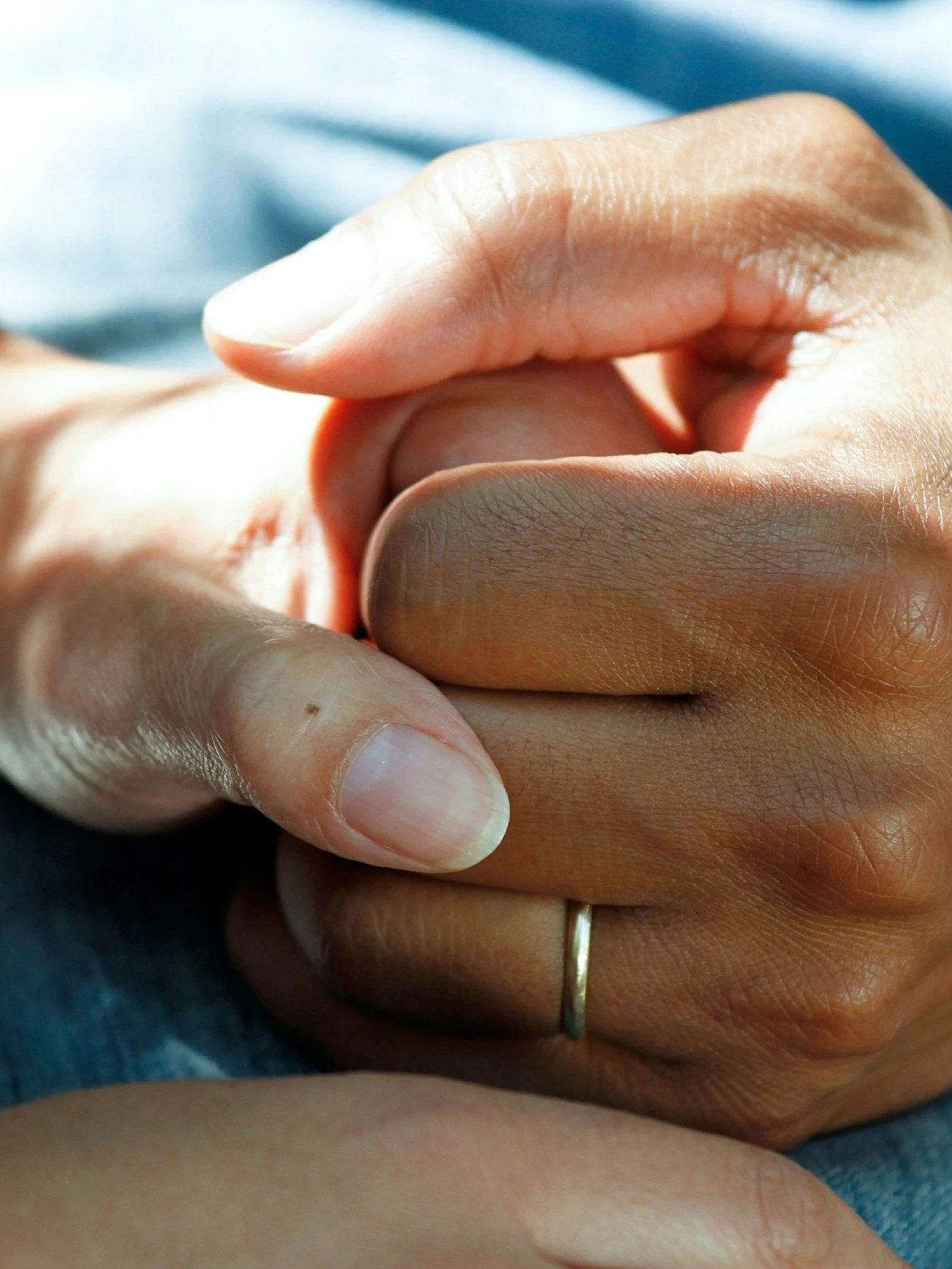 Hands griping each other in support.