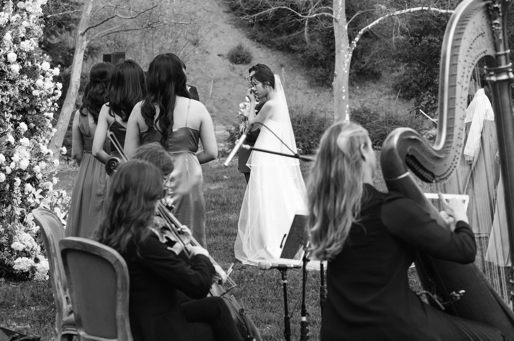 an image of a classical string trio playing for a wedding ceremony in Malibu California