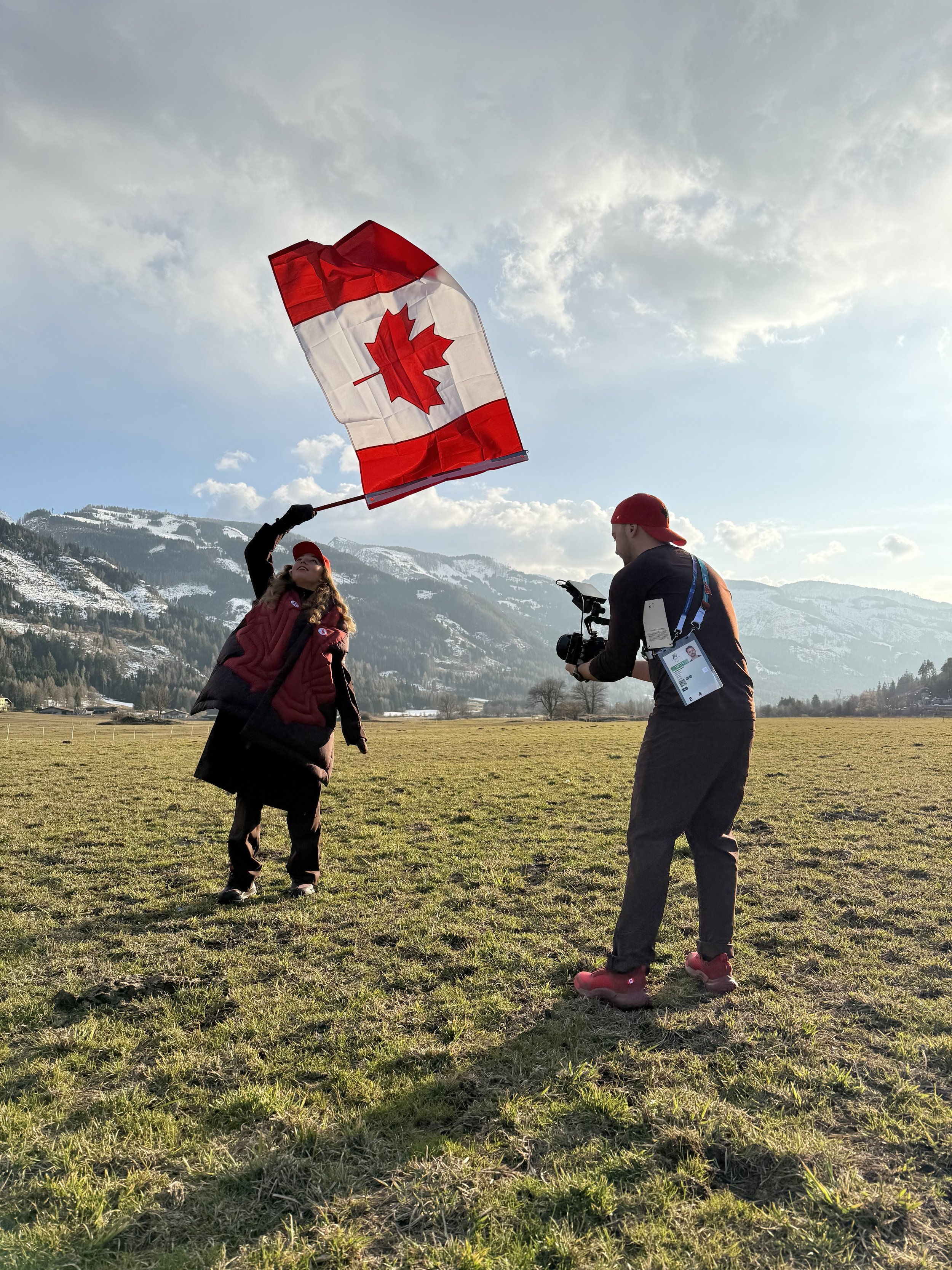 Natalie Wilkie holds flag at the Milano Cortina 2026 Paralympic winter Games
