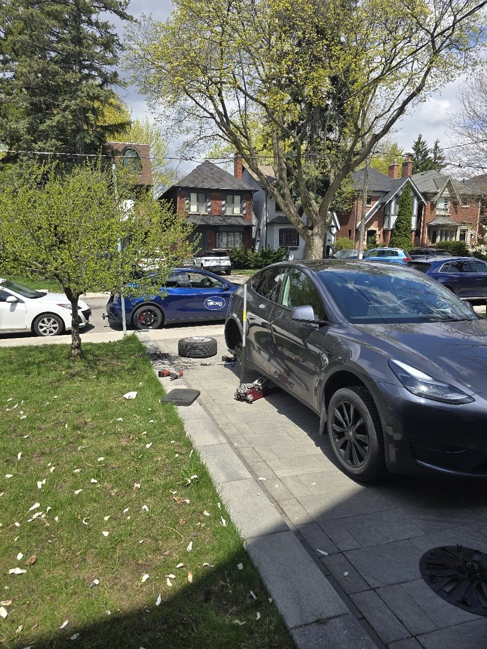 Tesla seasonal tire change on-rim in Toronto, Ontario. Service performed in customer's driveway, Lawrence & Avenue Road area.