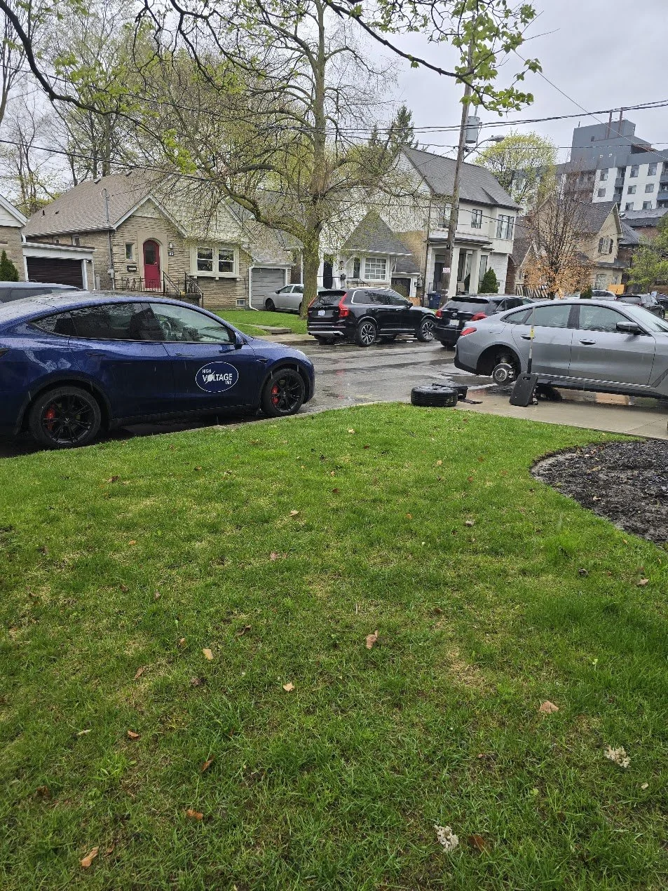 EV Mobile Tire Repair Service - fixing a punctured tire for a BMW i4 in Toronto Midtown.