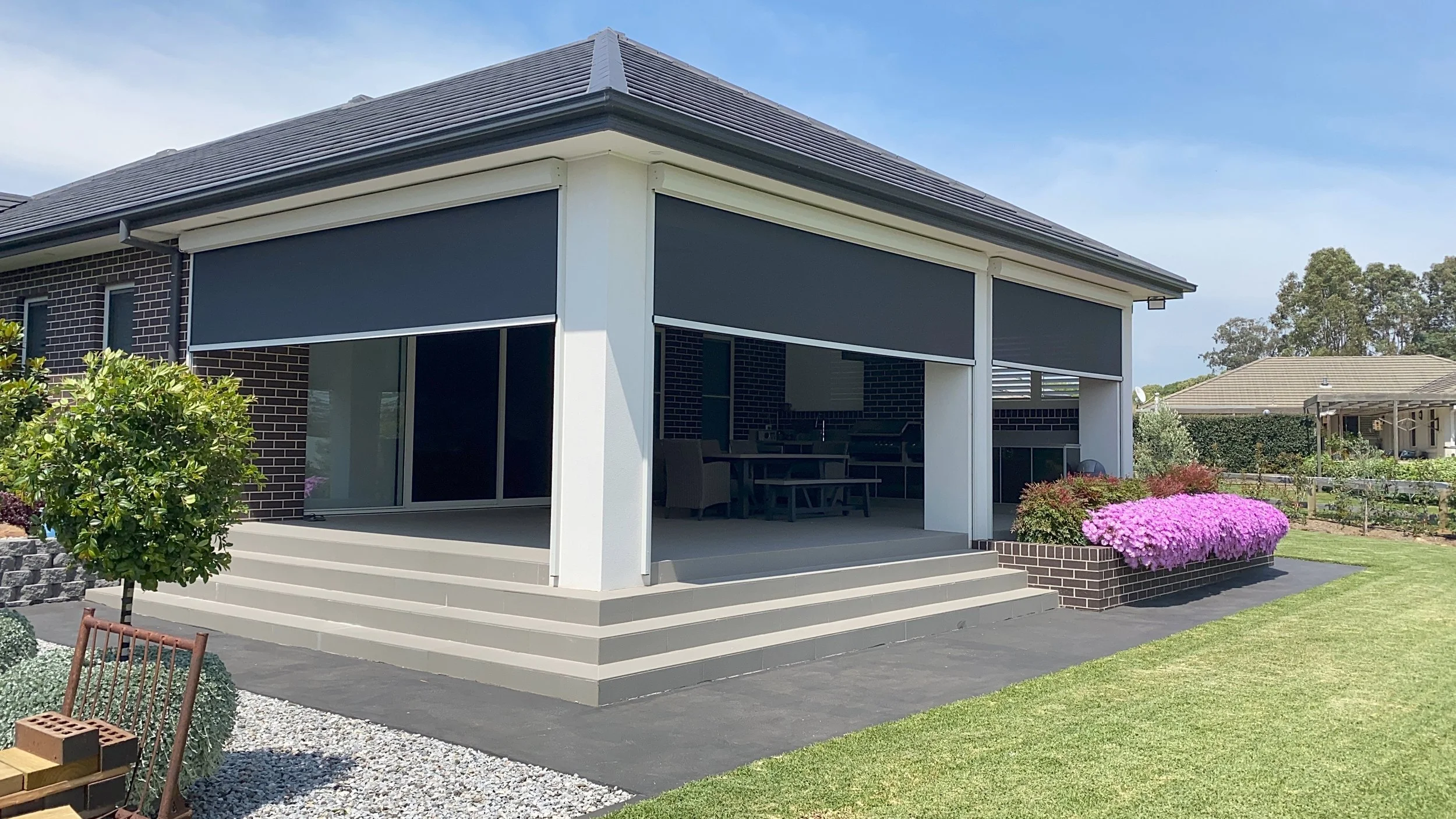 Ziptrak outdoor blinds controlling light and privacy for an indoor outdoor dining area