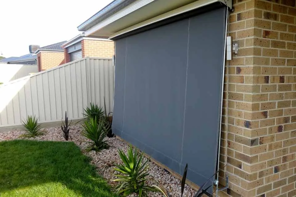 Fixed guide blinds available in canvas or woven mesh, providing shade and privacy