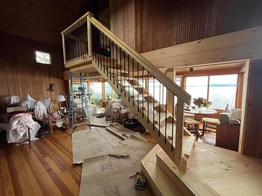 Floating stairs and landing, preserving open feel of living room.