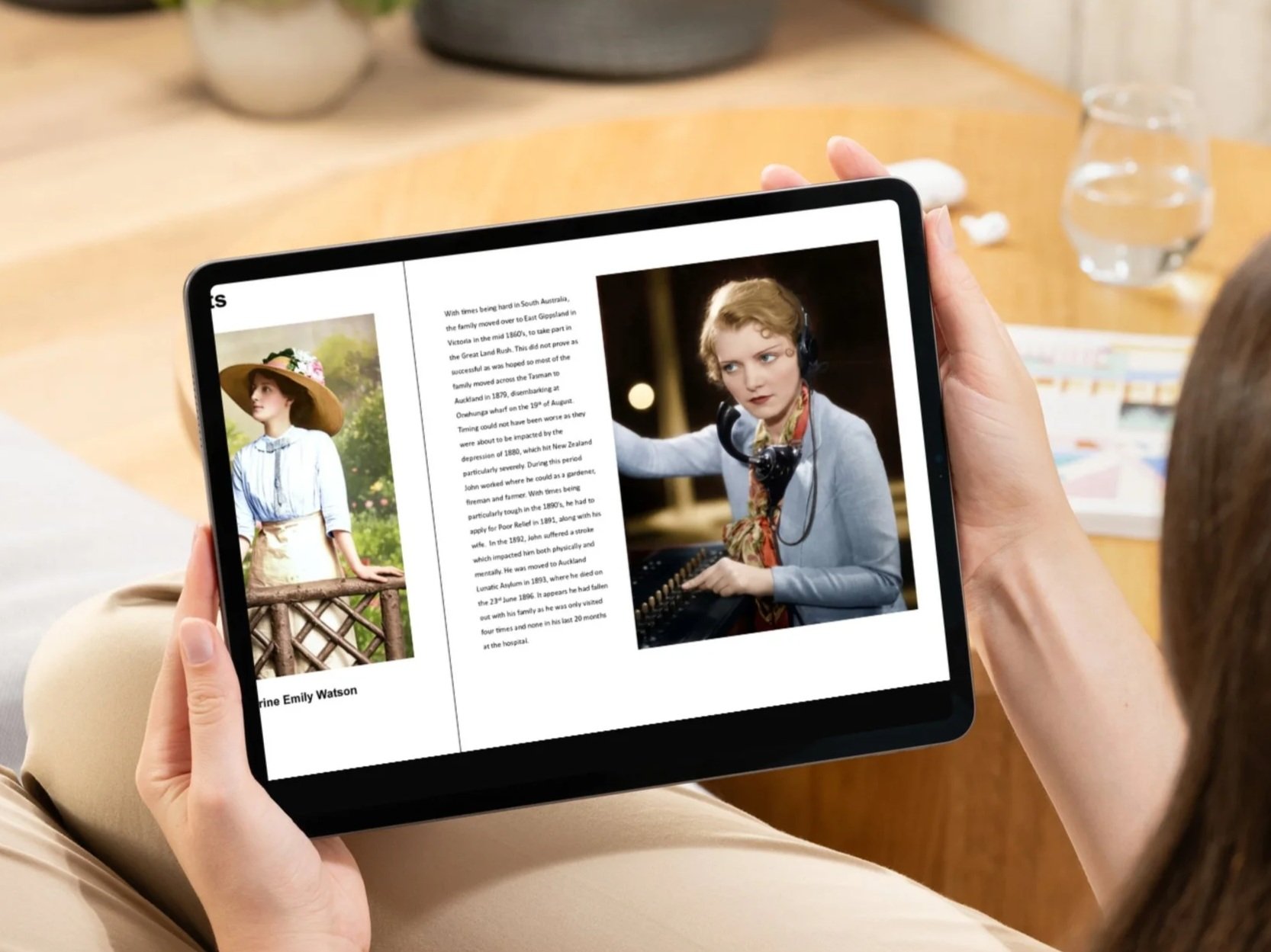 Person holding a tablet displaying a photo of a woman in a hat outdoors and a woman working at a soundboard in a studio. In the background, there's a water glass on a table.