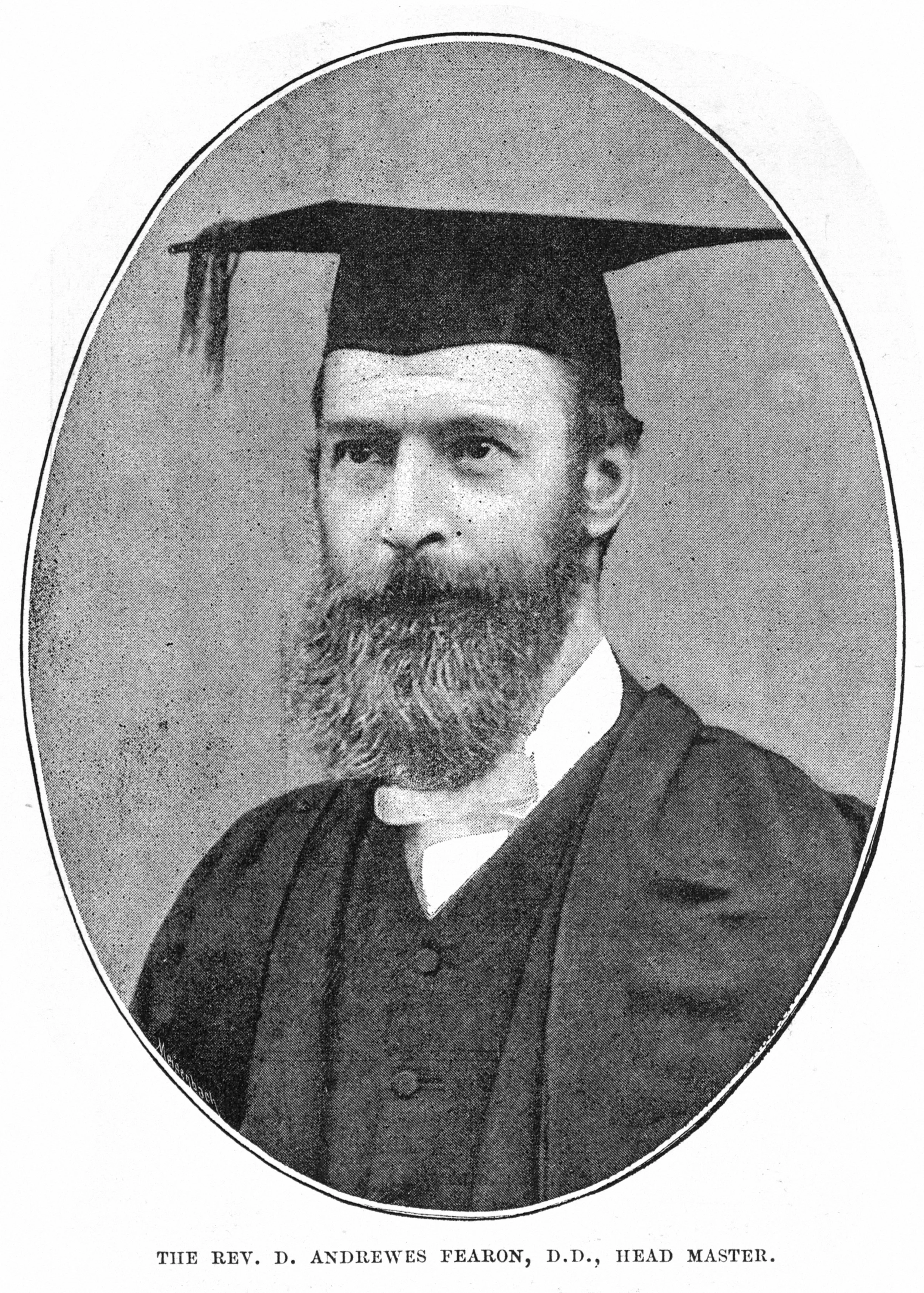 Black and white photo of Reverend D. Andrew Fearon, D.D., Head Master, wearing a graduation cap and gown, with a serious expression, posed within an oval frame.