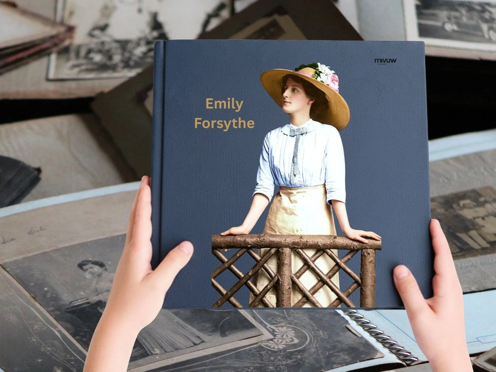 Image of a My Past Photobook featuring a young woman in vintage clothing, wearing a large hat with flowers, standing by a wooden railing, on a blue background with the text "Emily Forsythe".