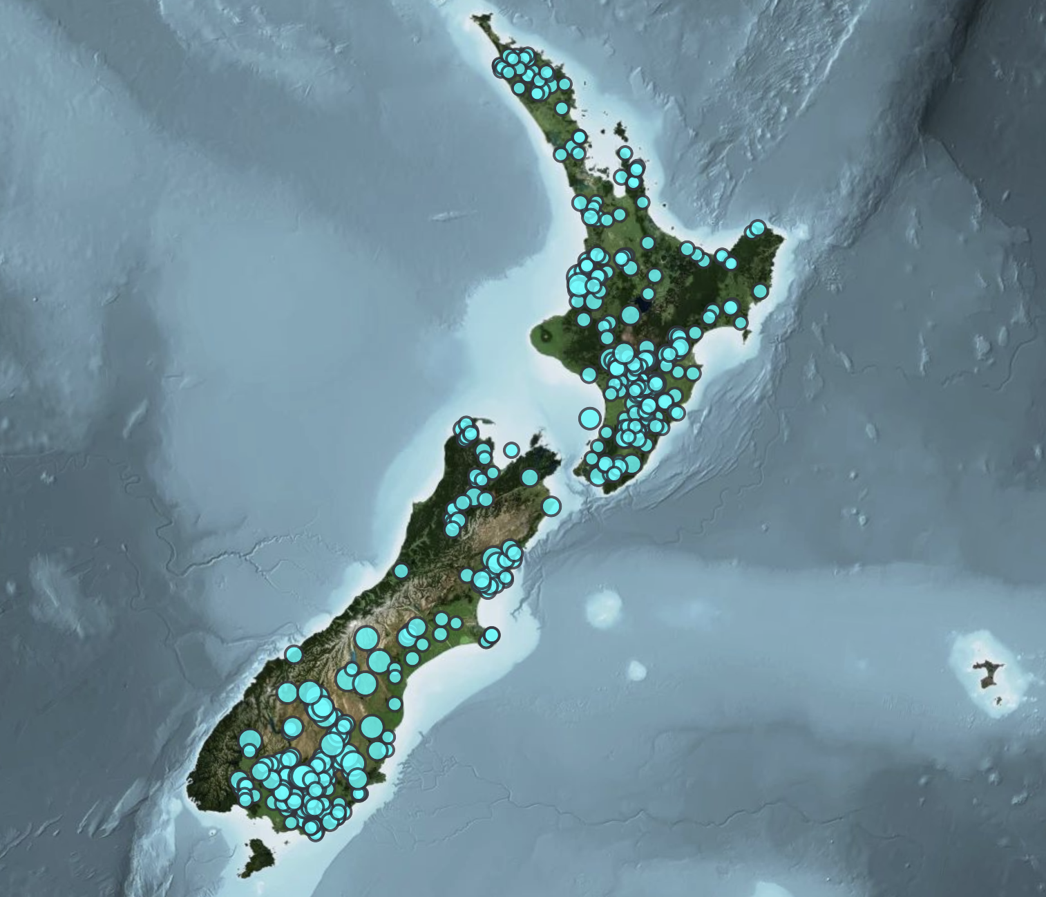 Map showing the North and South Islands of New Zealand with numerous blue dots indicating locations or points of interest, set against a satellite view of surrounding ocean.