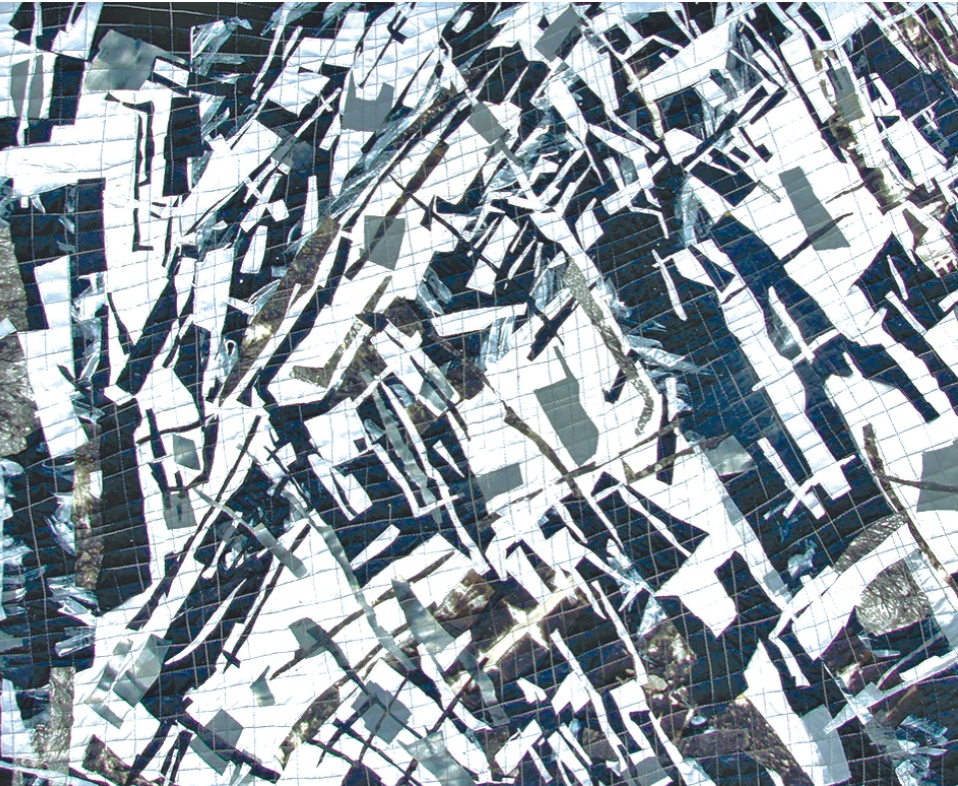 Close-up of a shattered reflective surface with broken mirror pieces and cracked tiles.