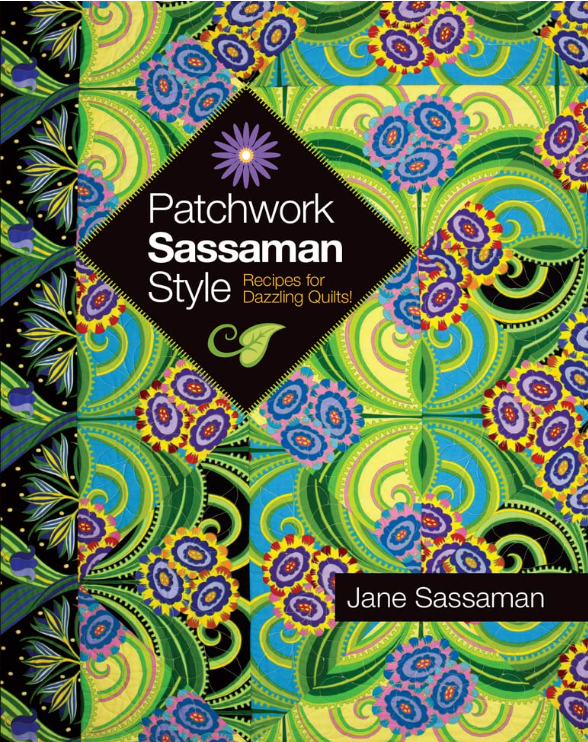 Book cover titled 'Patchwork Sassaman Style' by Jane Sassaman. The cover features a vibrant patchwork quilt pattern with swirls and floral designs in shades of green, blue, purple, and black.