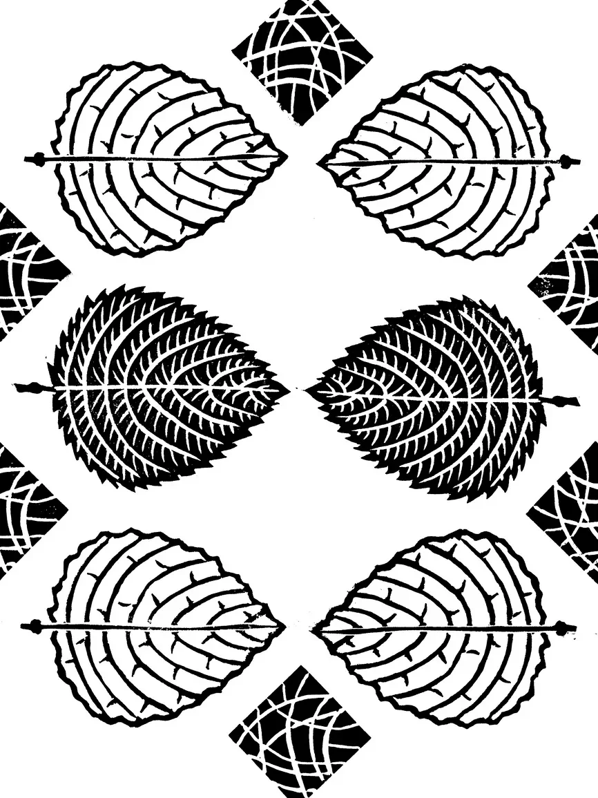 Pattern of black and white stylized leaf shapes and geometric designs arranged symmetrically.
