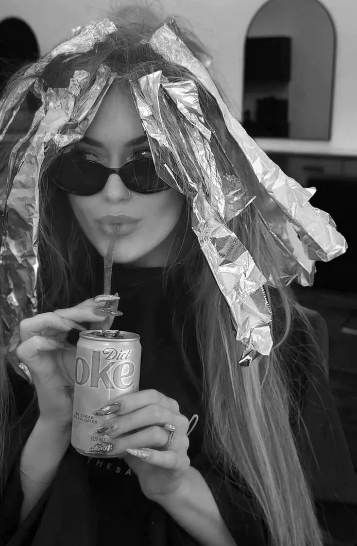 Luxury blonding service in progress at Zazú Salons featuring dimensional foil placement and personalized color application.