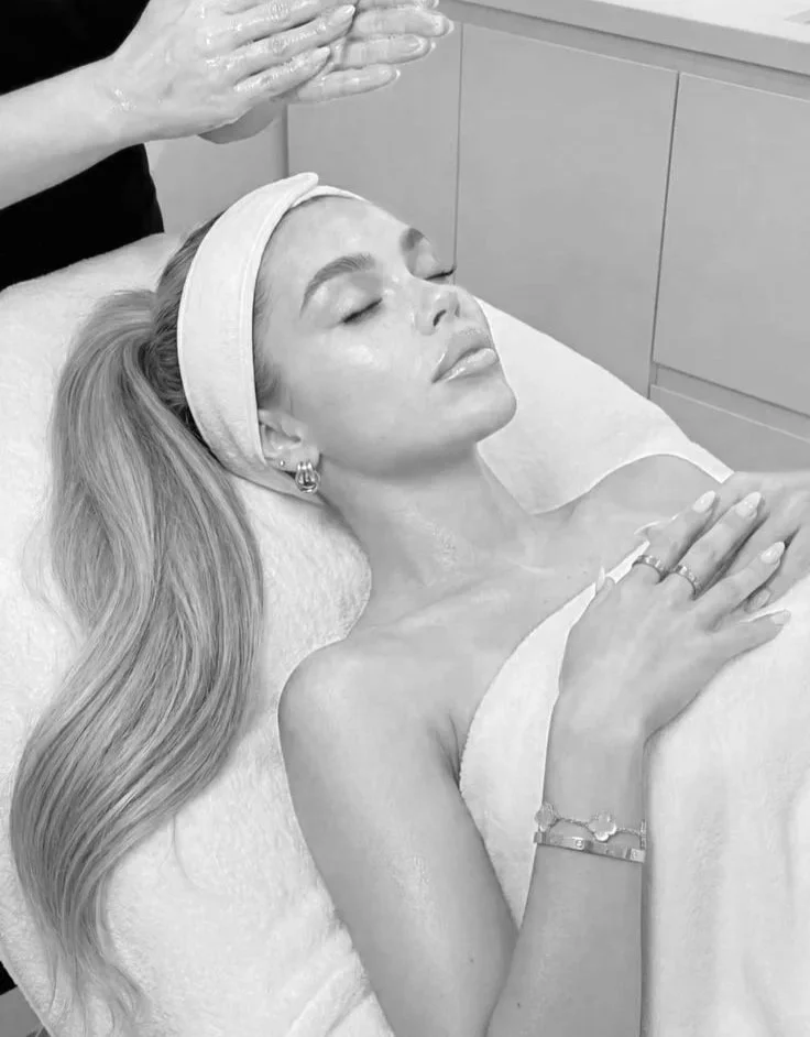 Woman receiving a luxury facial treatment at Zazú Spa in a relaxing spa environment.