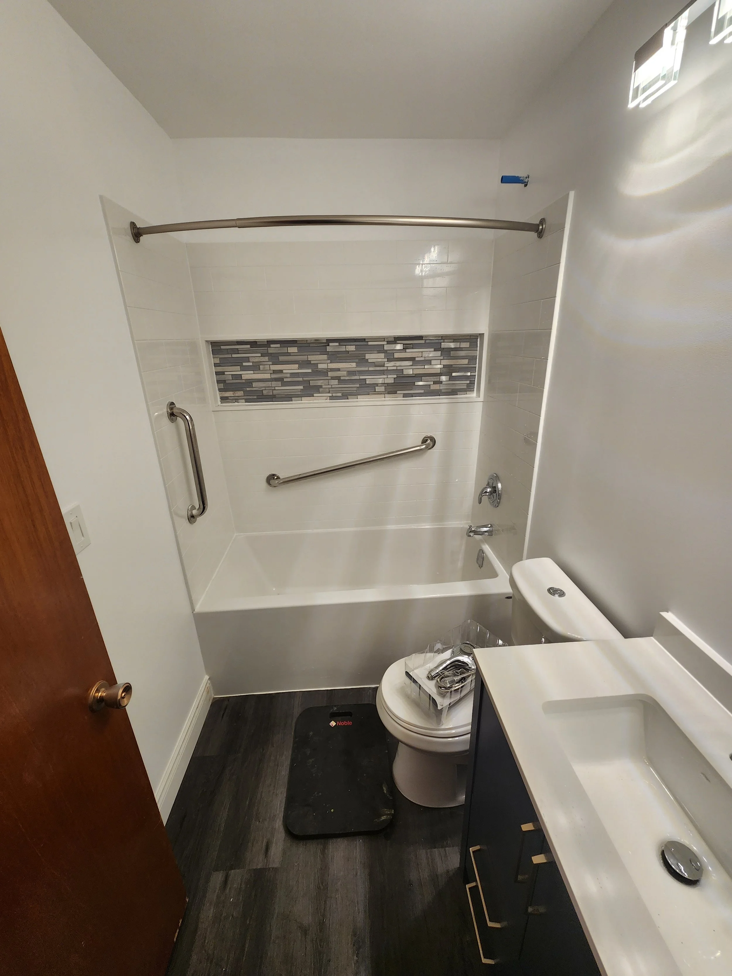 Complete 3 piece bathroom
Acrylic shower insert with accent tile
