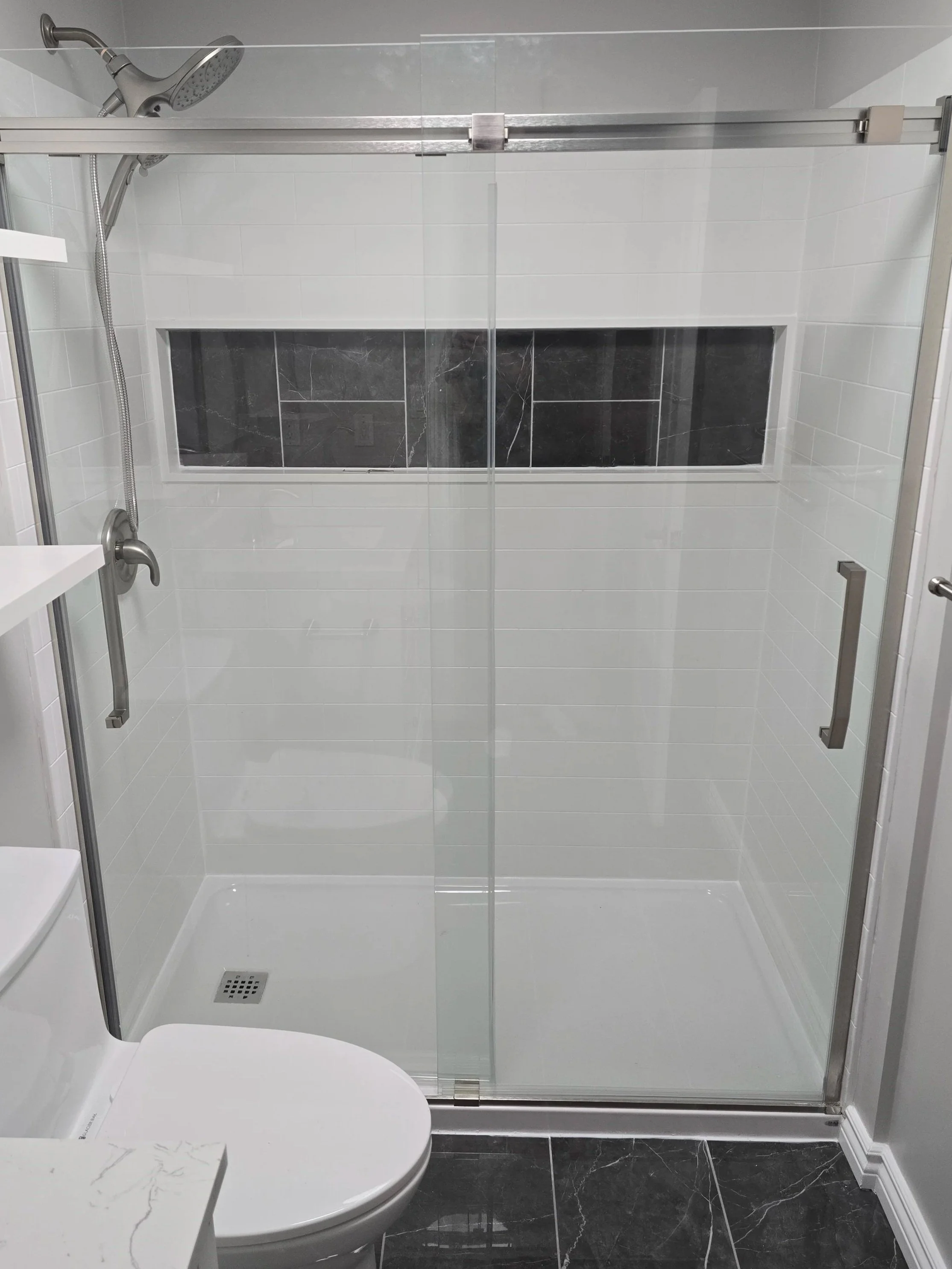 Acrylic shower insert with tile accent
