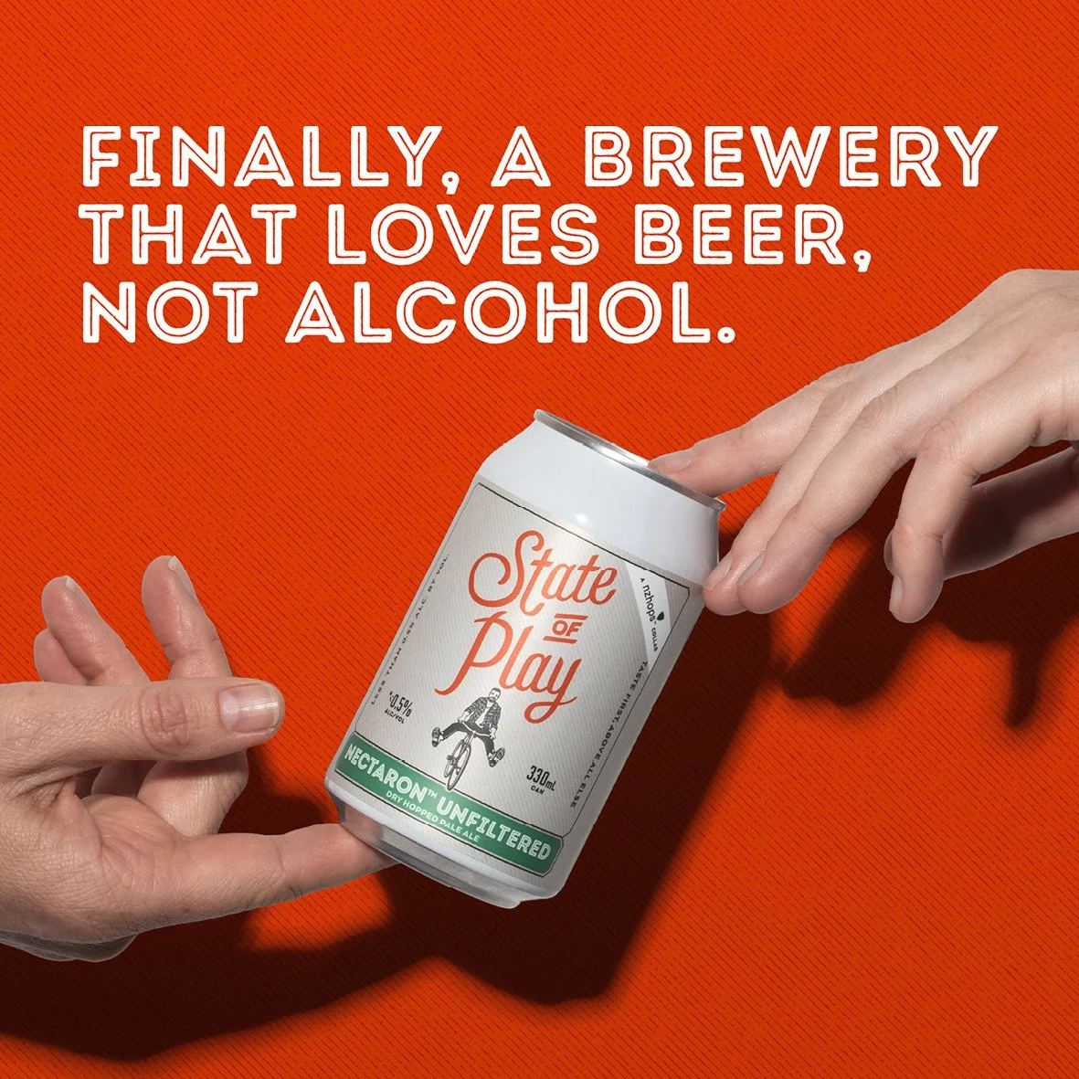 Can of beer balanced between two hands. Headline says 'Finally, a brewery that loves beer, not alcohol.' Studio photography, packaging design, branding, designer. Alice Lloyd.
