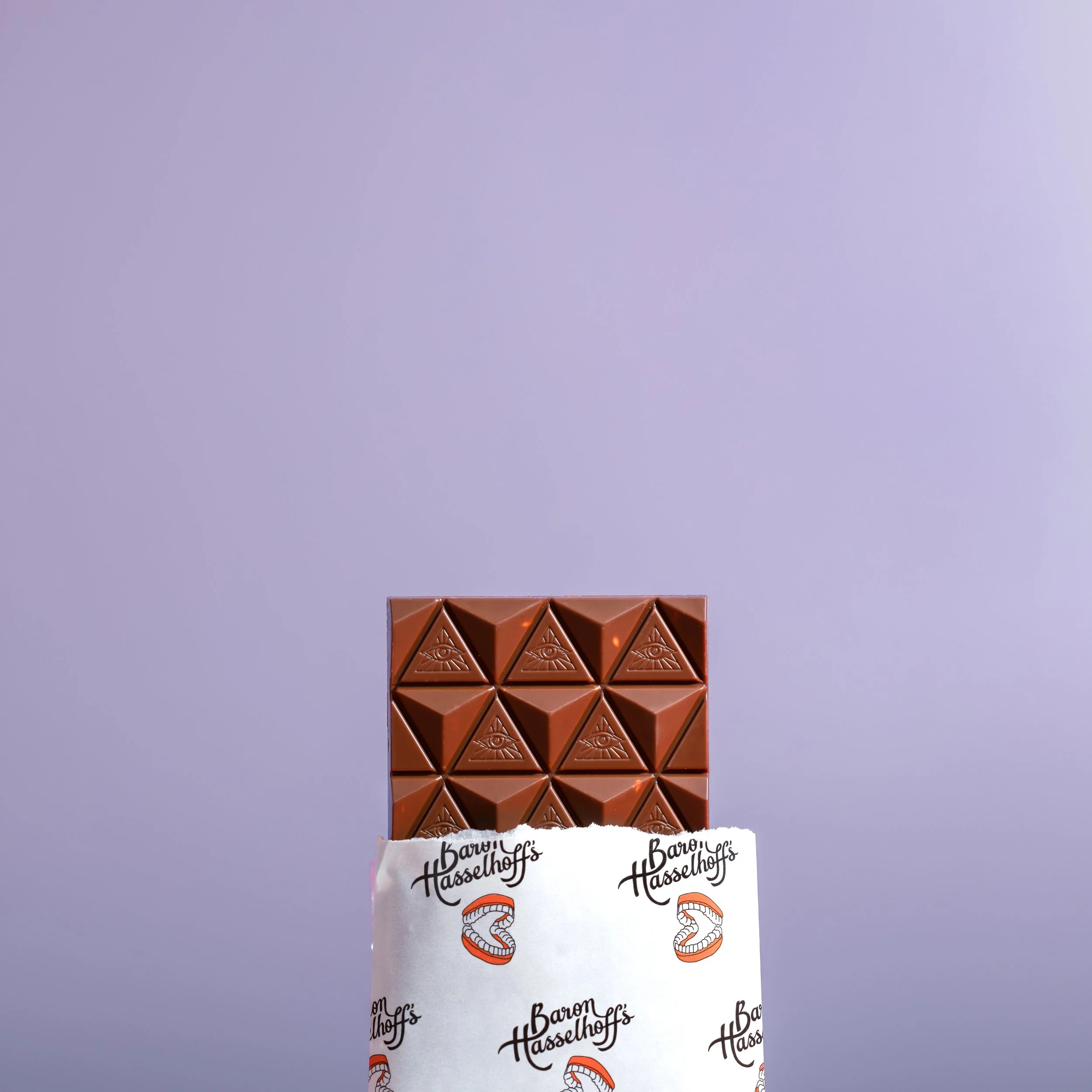 Baron Hasselhoff's chocolate bar on a purple lilac background. Studio photography, packaging design, branding, typography, designer. Alice Lloyd.