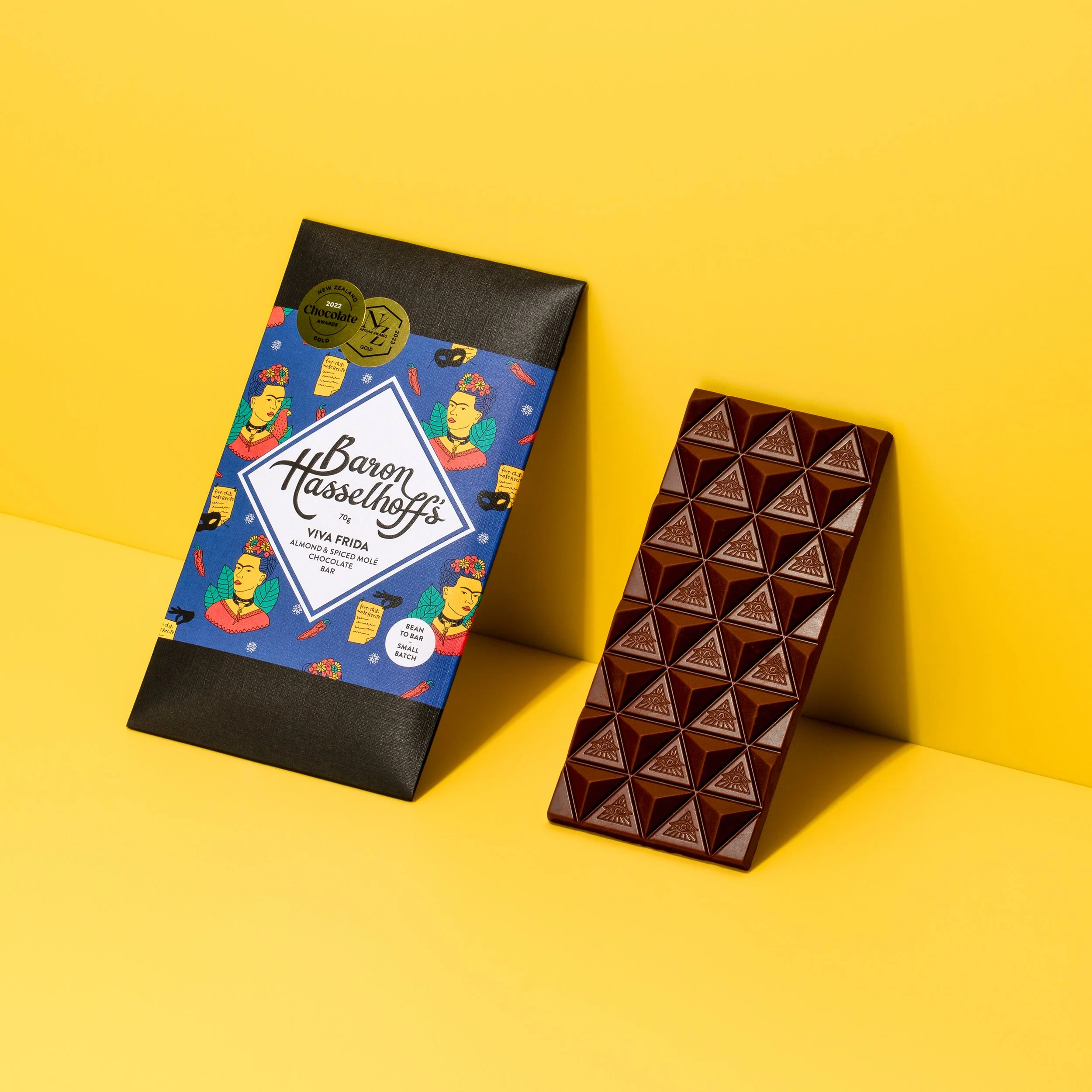 Baron Hasselhoff's Viva Frida chocolate bar on a yellow background. Studio photography, packaging design, branding, typography, designer. Alice Lloyd.