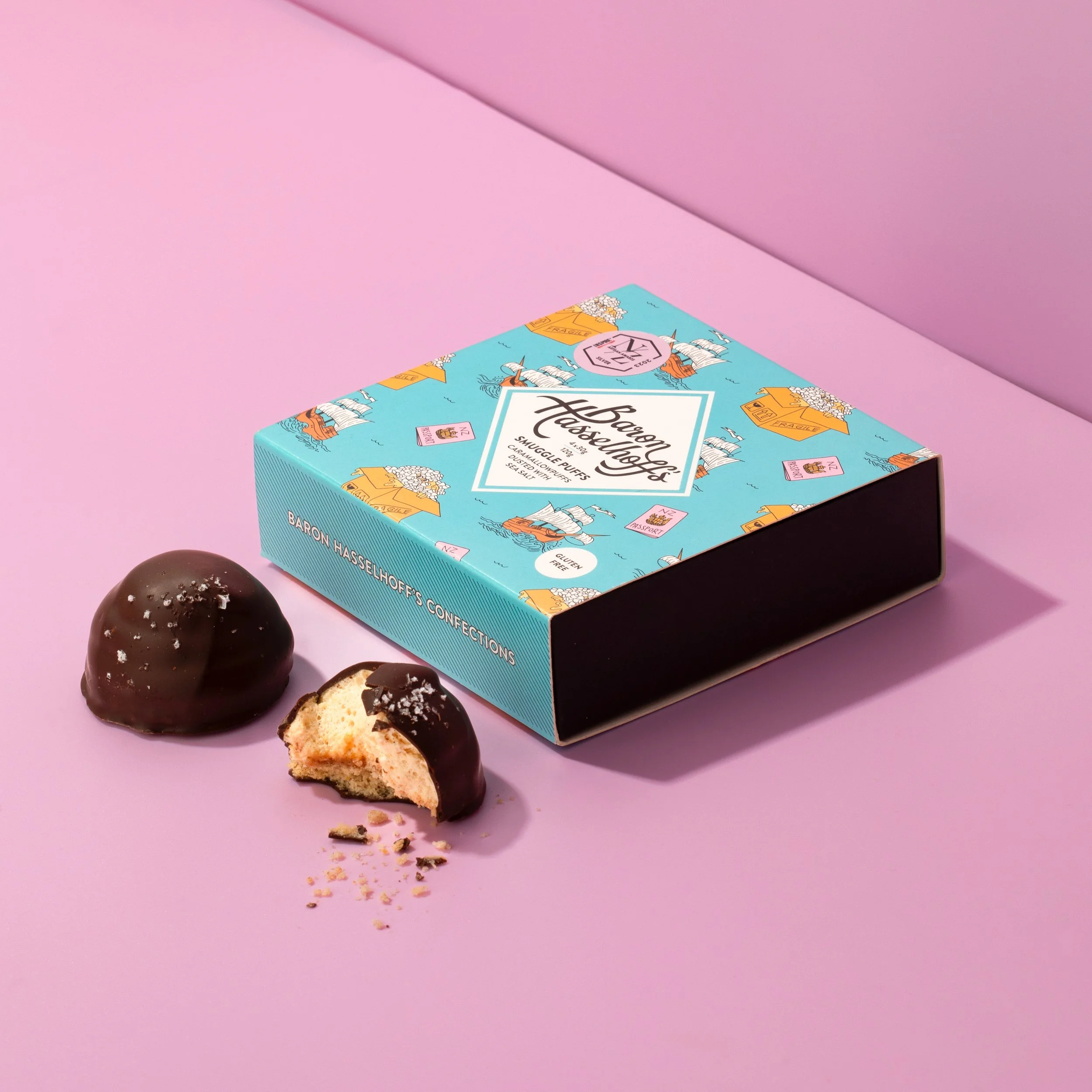 Baron Hasselhoff's Smuggle Puffs on a pink background. Studio photography, packaging design, branding, typography, designer. Alice Lloyd.