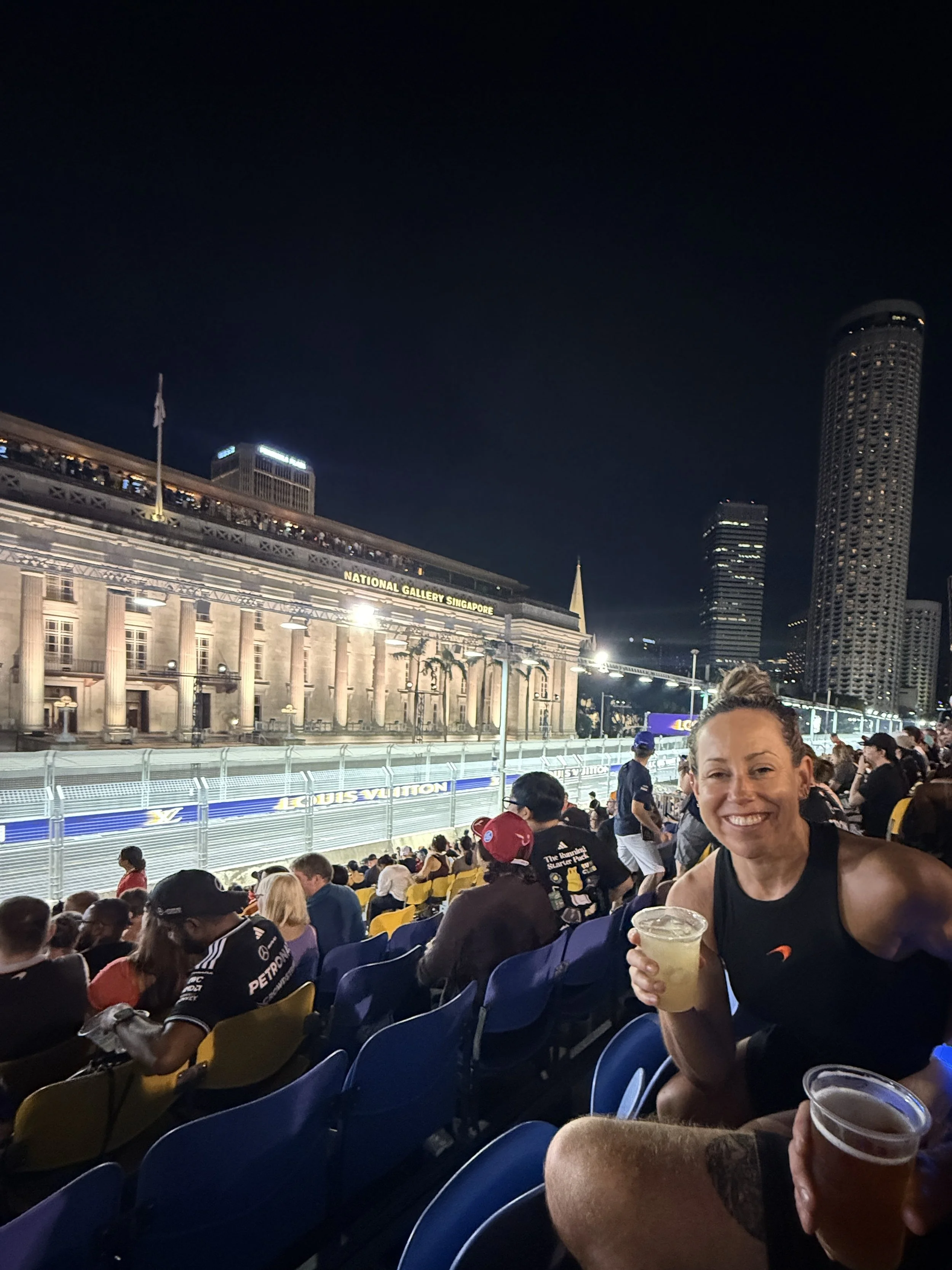 Night race at the Singapore Grand Prix, with the National Gallery Singapore building, Marina Bay Street Circuit. F1 race week experience.