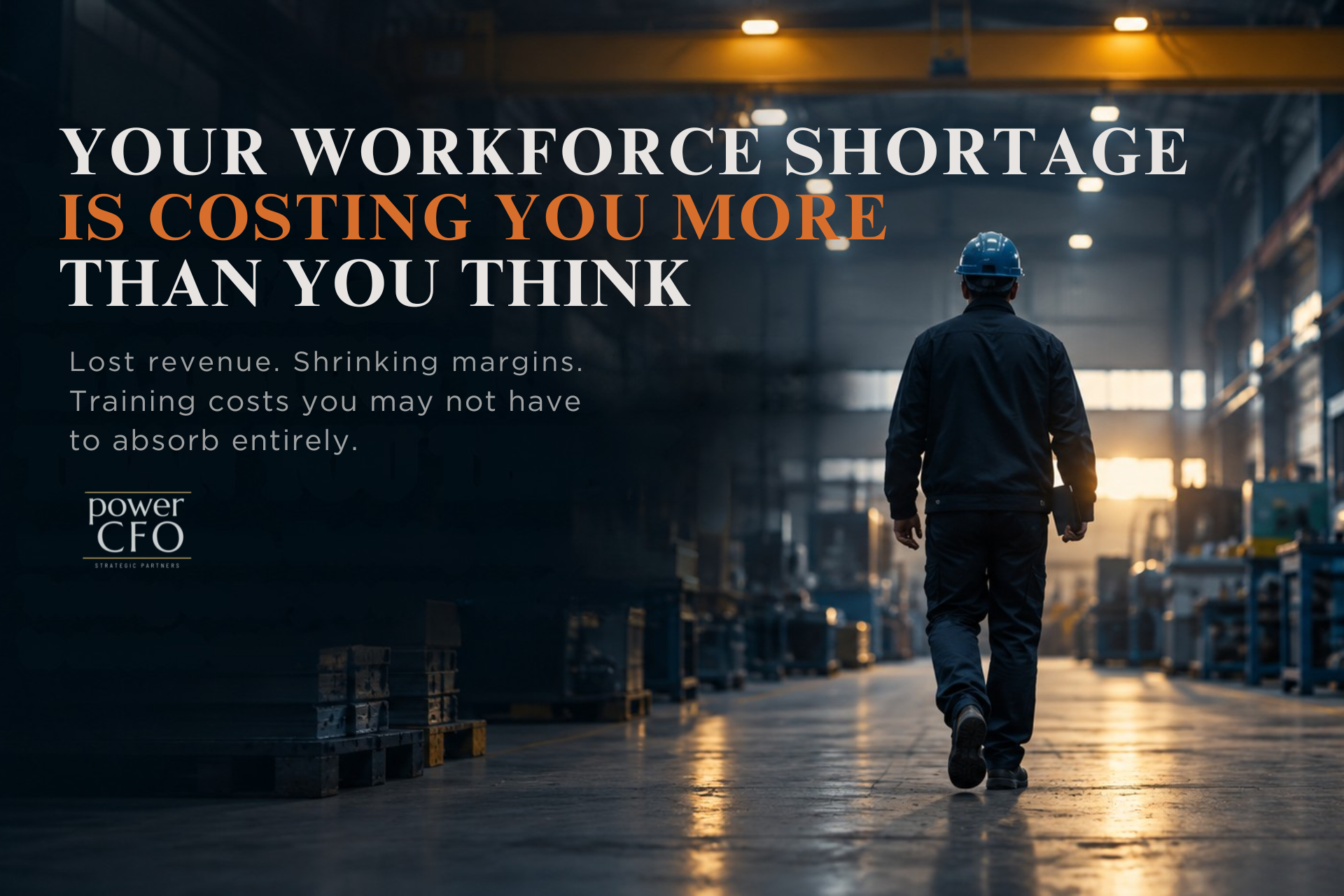 Worker walking through a manufacturing facility, representing workforce shortages, lost revenue, shrinking margins, and training costs.