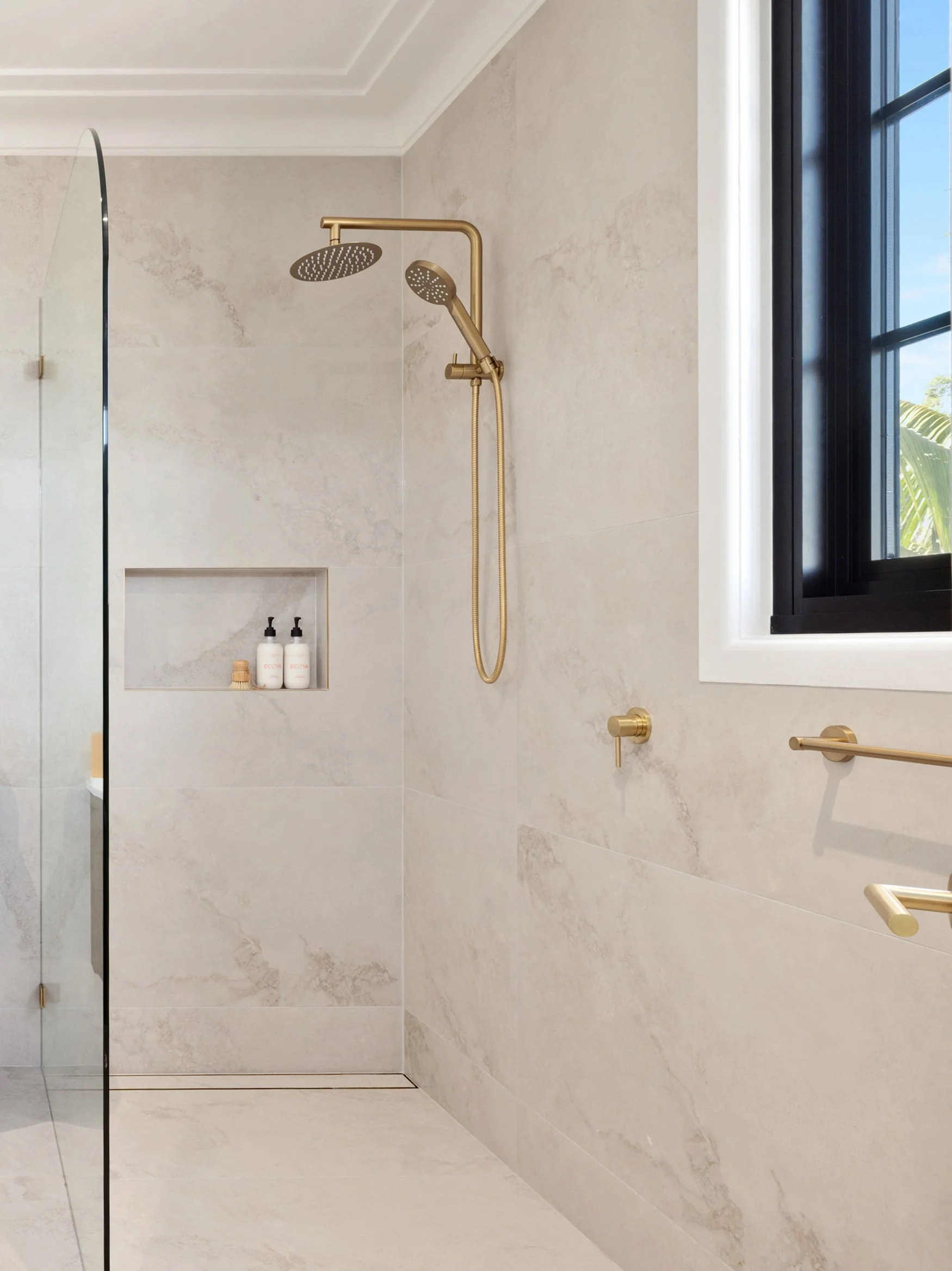 Shower shelf, warm neutrals, brushed brass