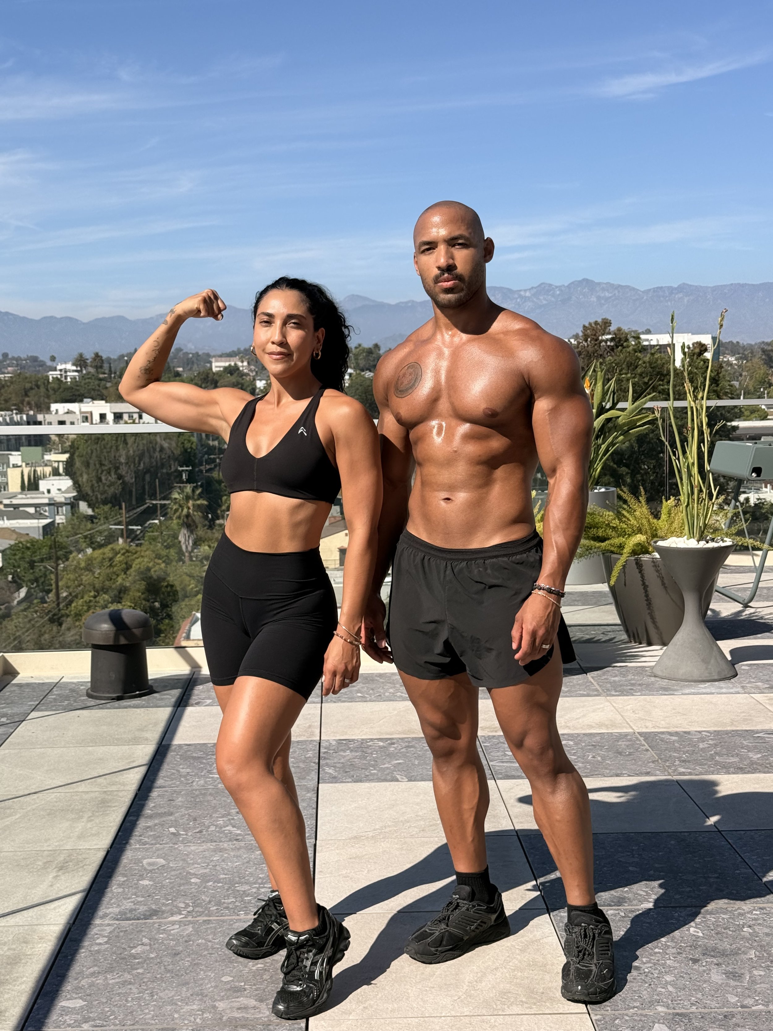 ALGNMNT coaches Angie and Jahfari together after a rooftop workout in Los Angeles