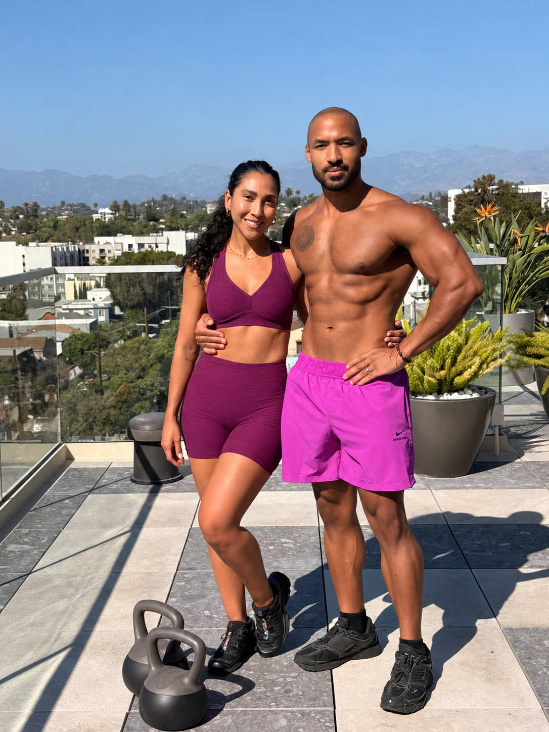 Angie and Jahfari together on the rooftop with kettlebells