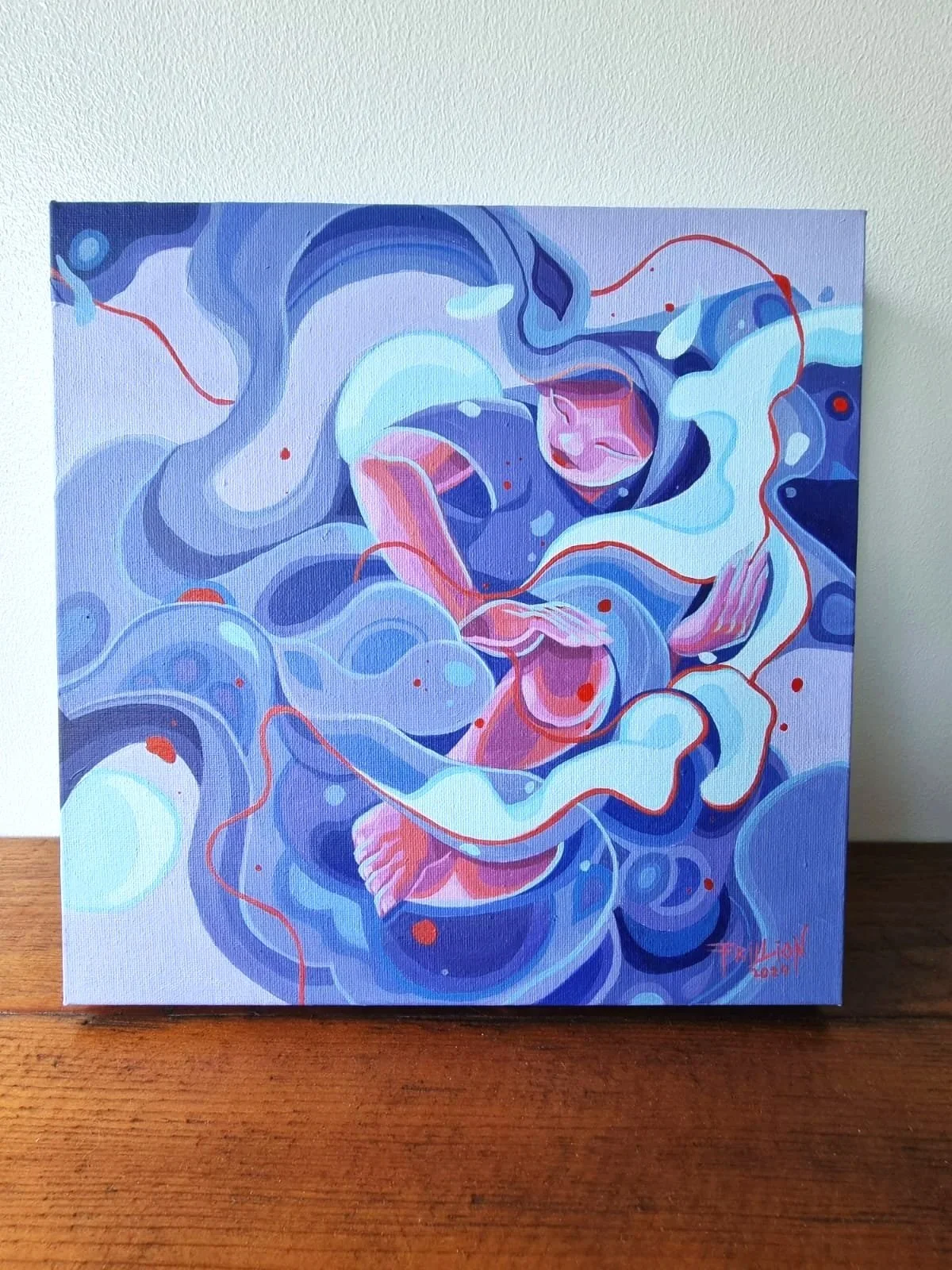 Colorful abstract painting with swirling blue, white, and red shapes, featuring a figure with pink skin and closed eyes in the center.