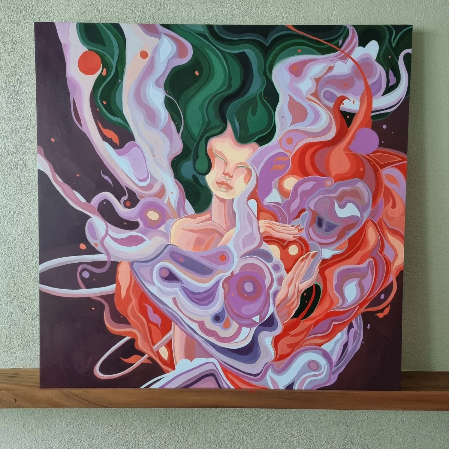 A colorful abstract painting of a female figure with closed eyes, surrounded by swirling shapes in shades of purple, red, green, and lavender.