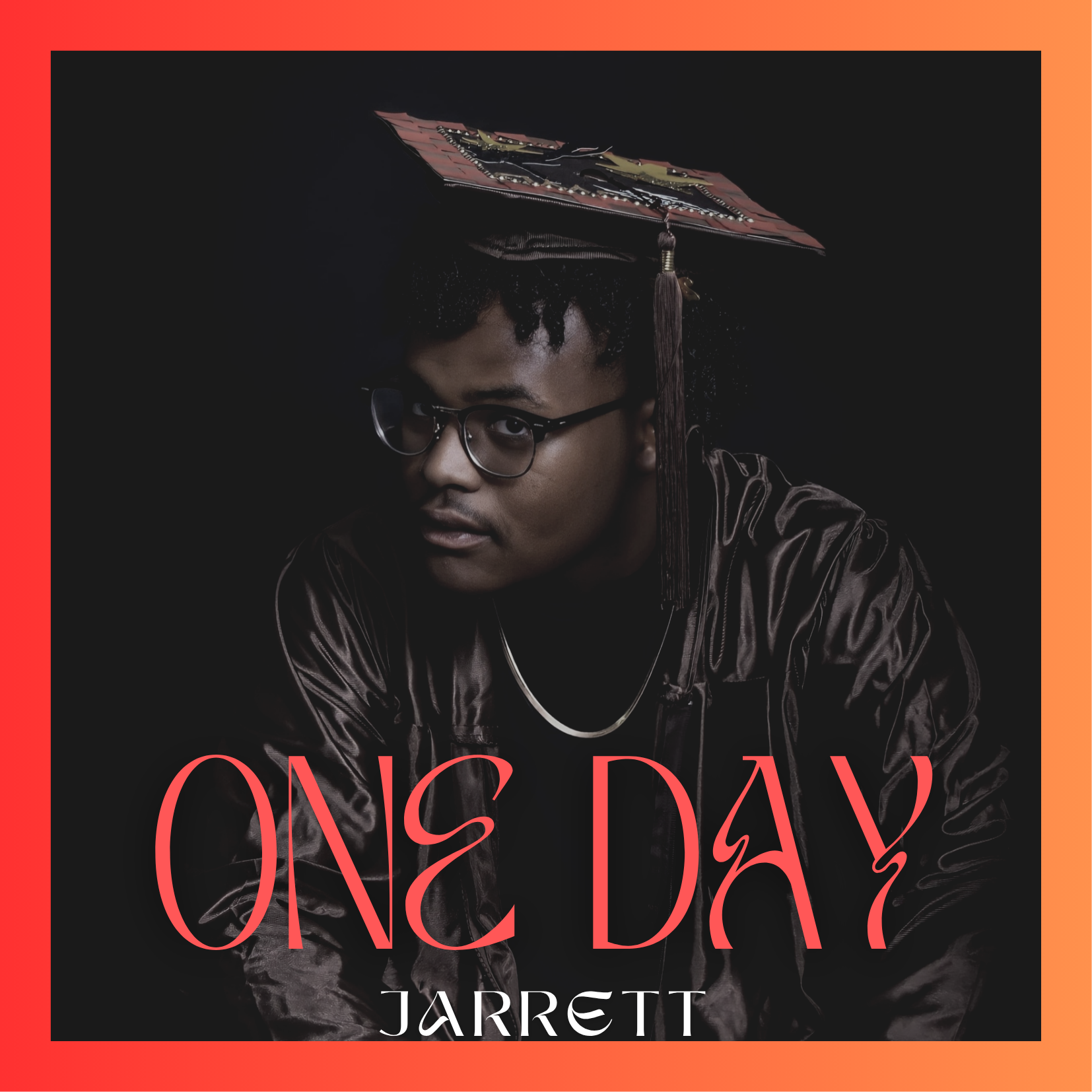 A young man with glasses wearing a graduation cap and gown, looking directly at the camera, with the words 'ONE DAY' and 'JARRETT' in red text on a black background.