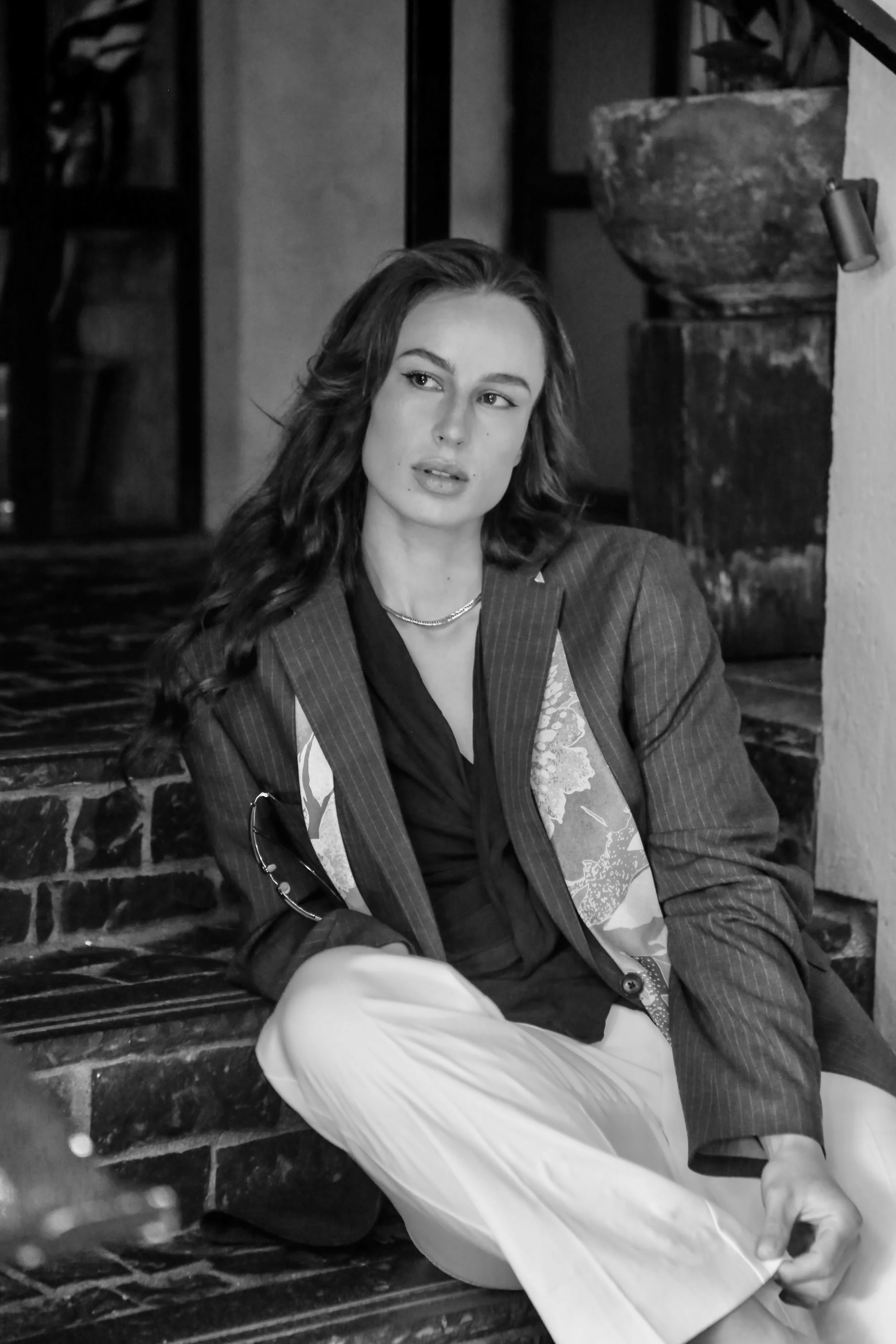 Black-and-white elegant portrait of Zana Renton for a website about page, featuring a timeless aesthetic, soft lighting, a composed expression, and a refined, professional presence.